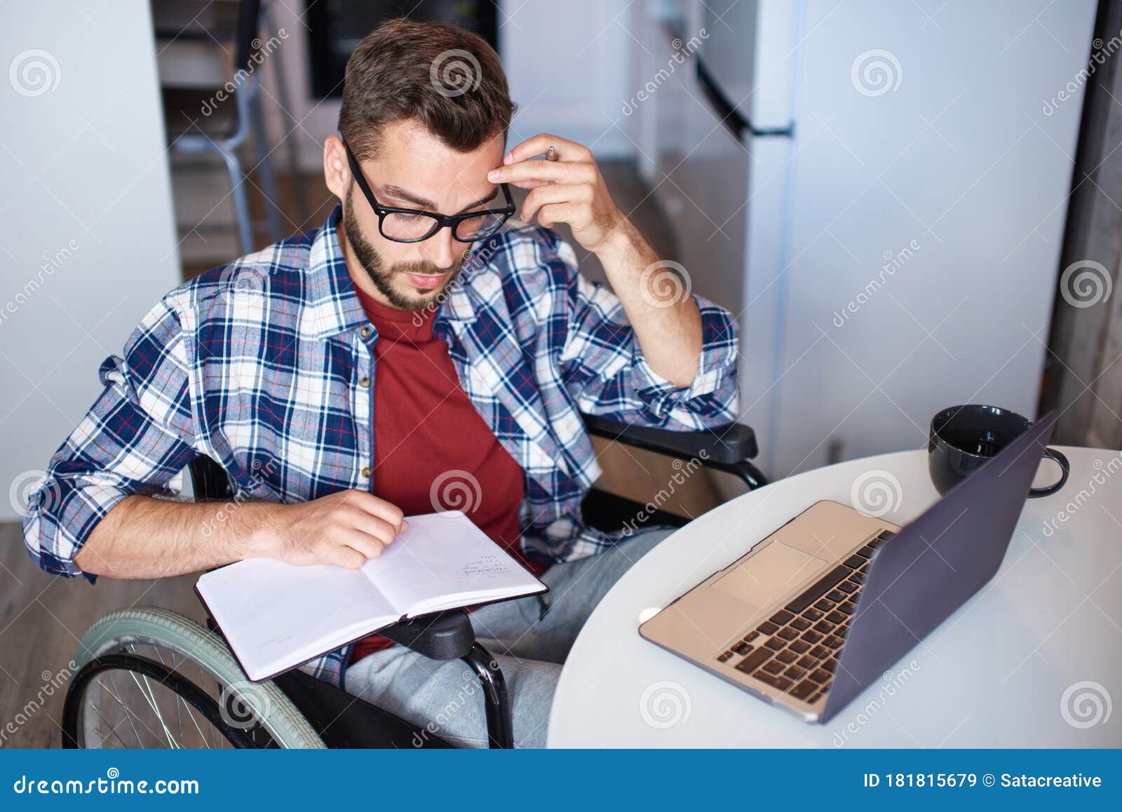 Moan And Move On Notepad Disabled Young Man Making Notes in Notepad while Using Laptop Stock