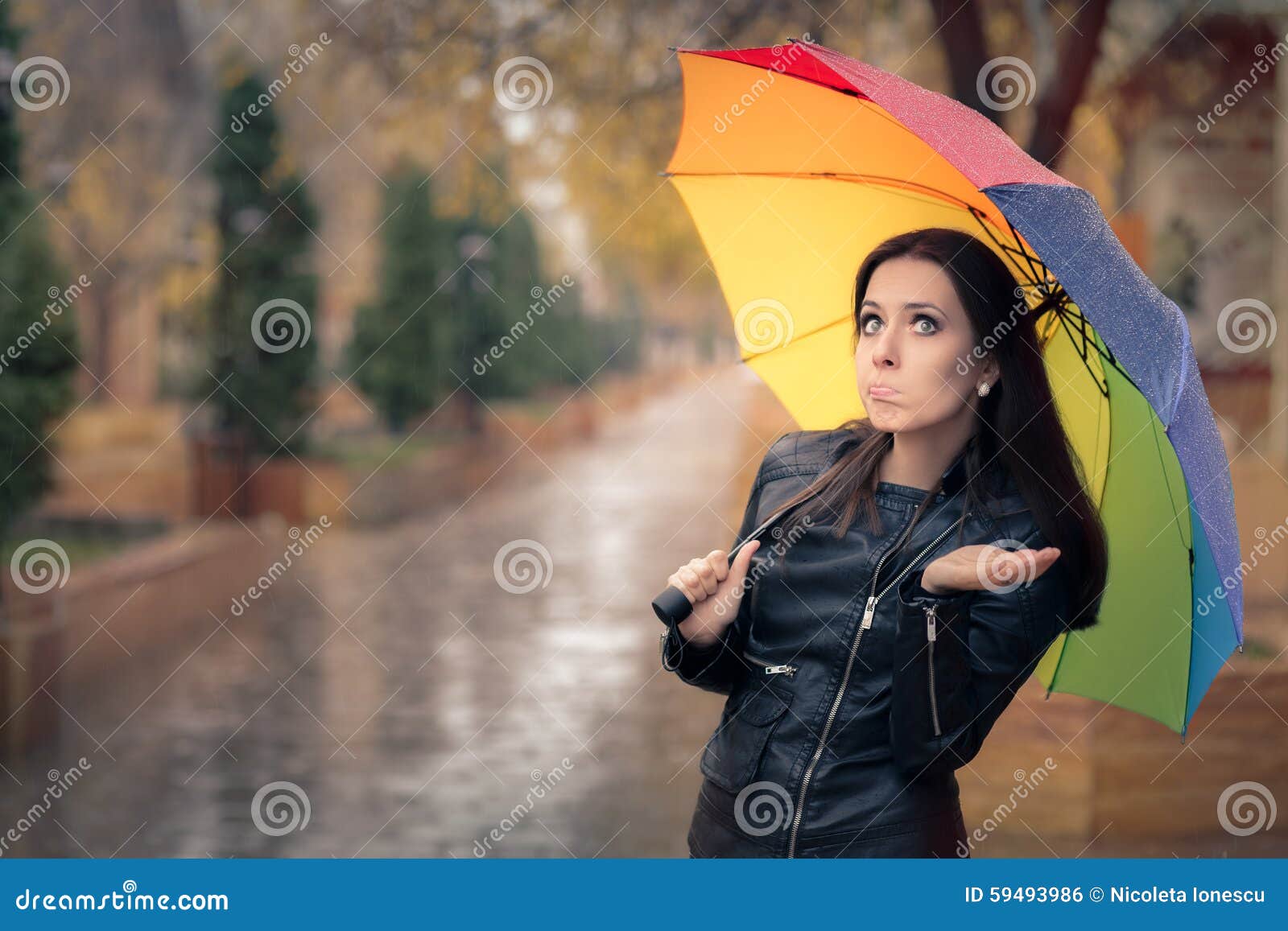 sad girl in the rain with umbrella