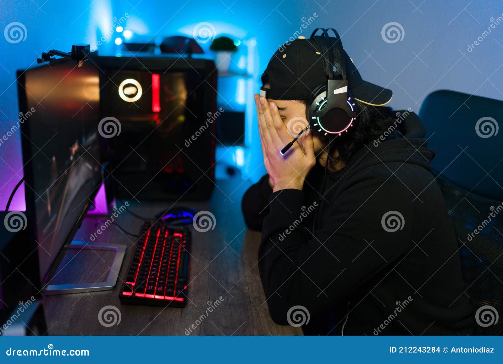 Premium Photo  Man feeling disapointed about losing video games on  computer. gamer with headphones using controller and playing online games  on monitor. sad player lost cyber game competition.