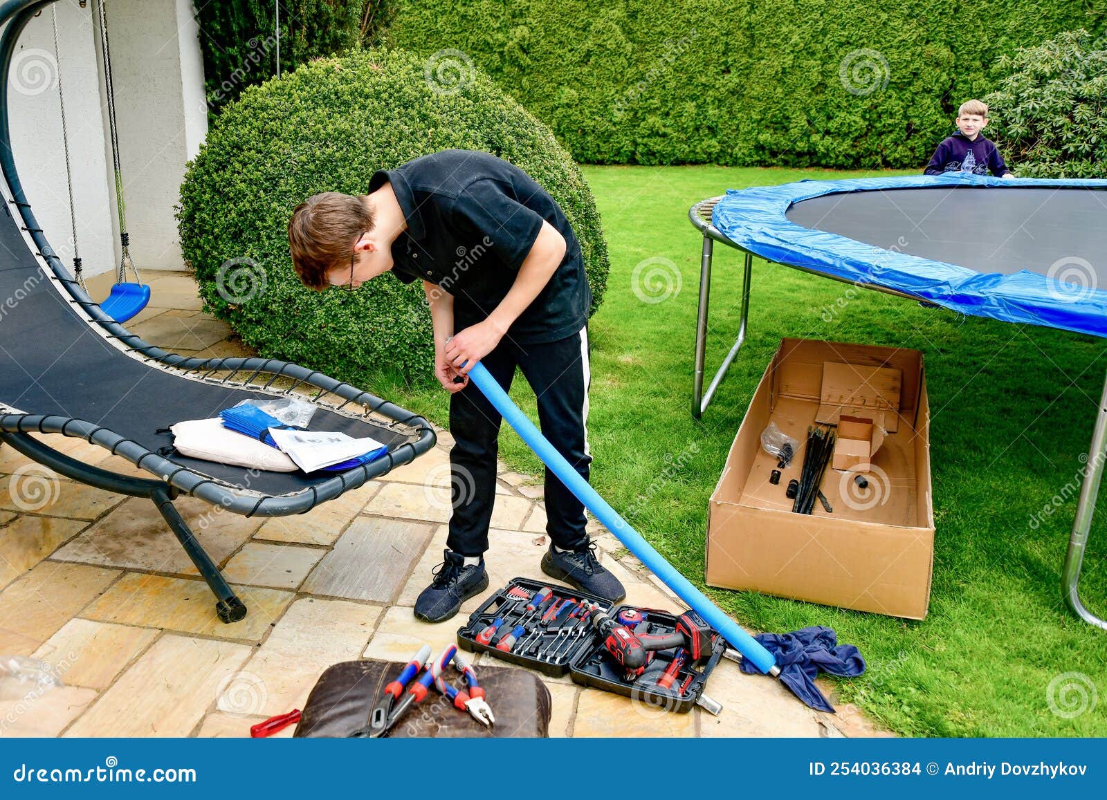 Disassembled Trampoline in the Yard after Purchase. Assembly and