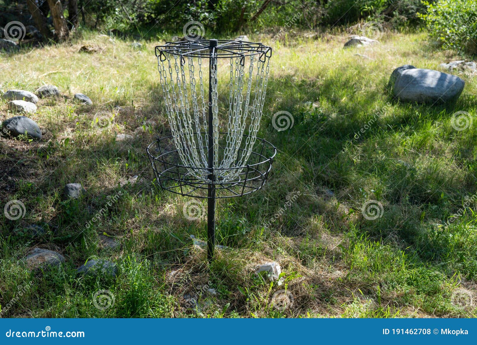 Disc Golf Cage Target, with Chains, in a Grassy Field Stock Photo