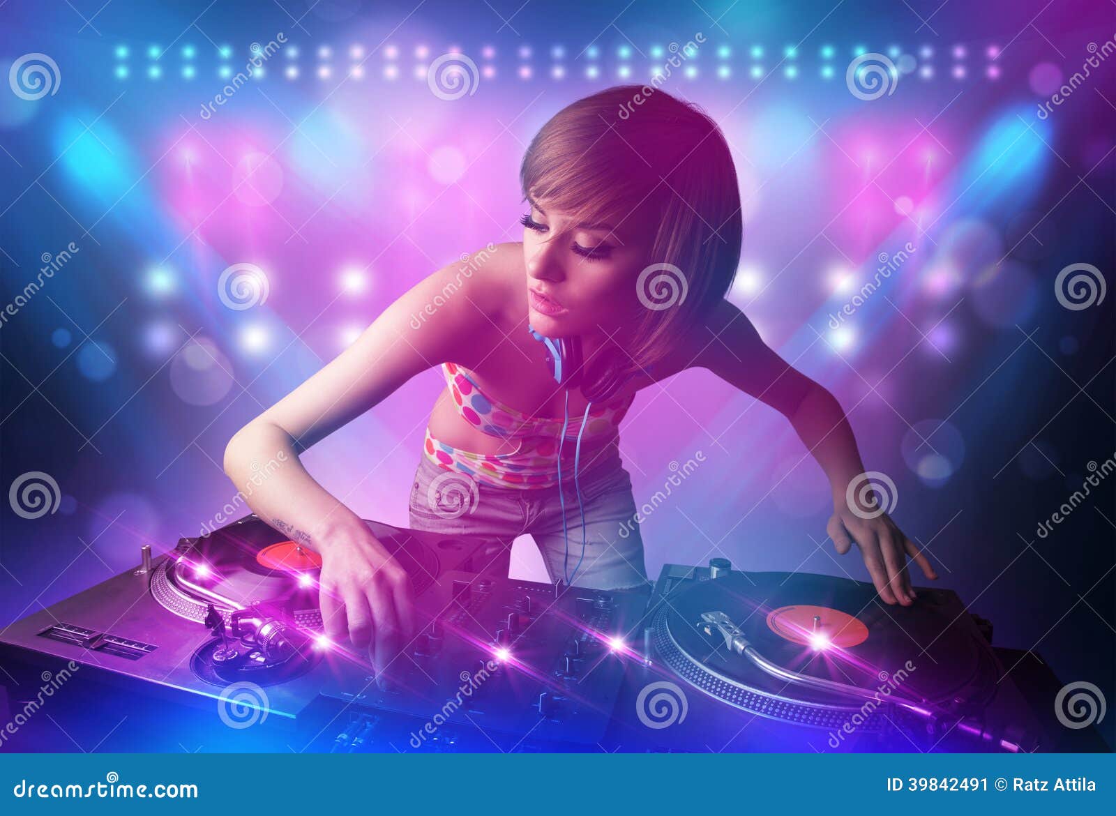 Disc Jockey Mixing Music on Turntables on Stage with Lights and Stock ...