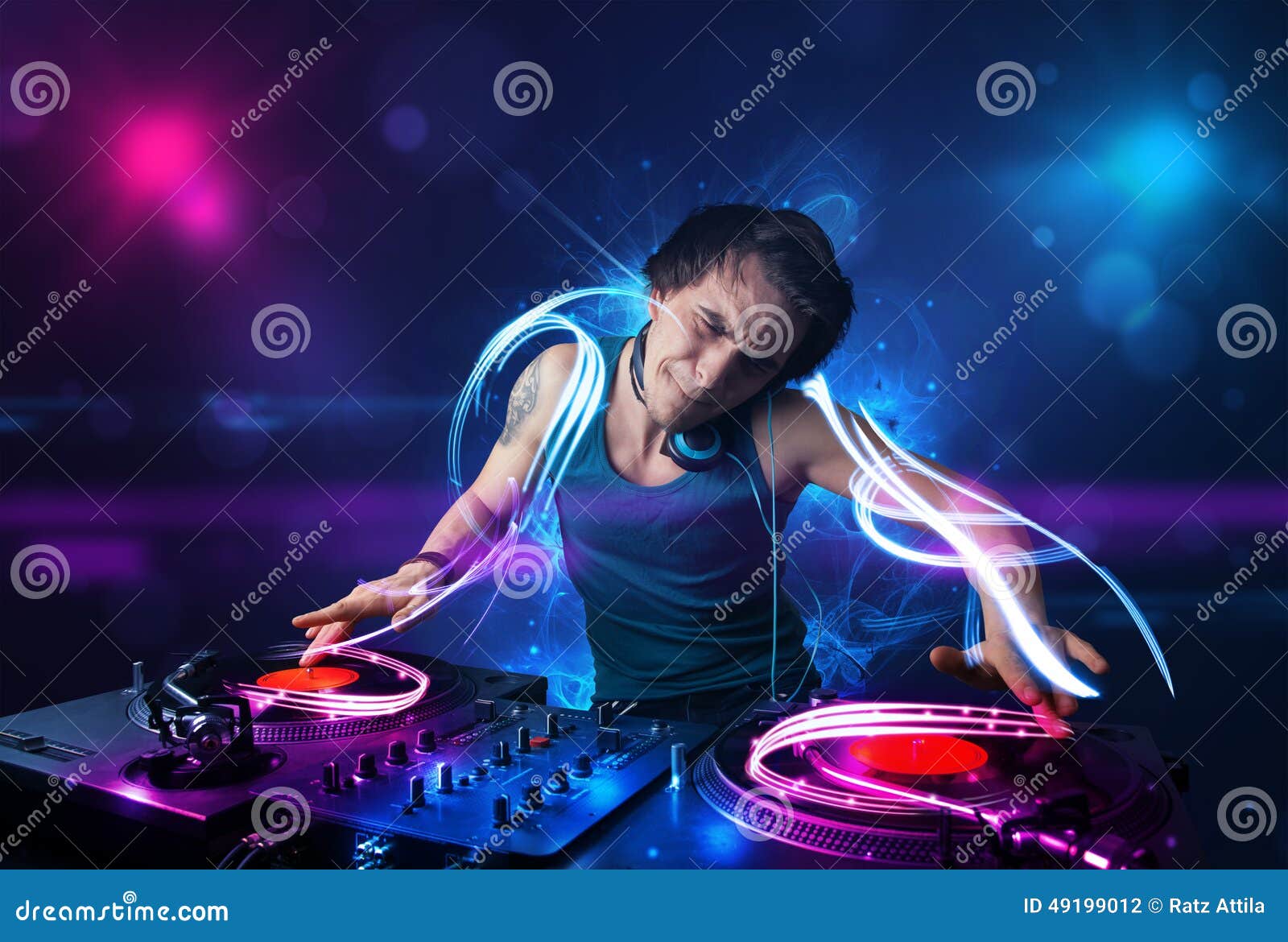 Disc Jockey Playing Music with Electro Light Effects and Lights Stock