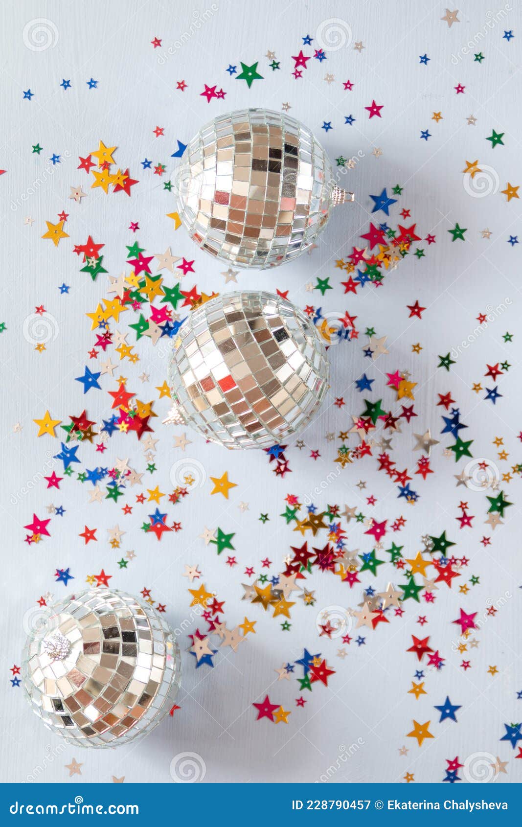 Disco Ball on Blue Background with Multicolored Stars Confetti Stock