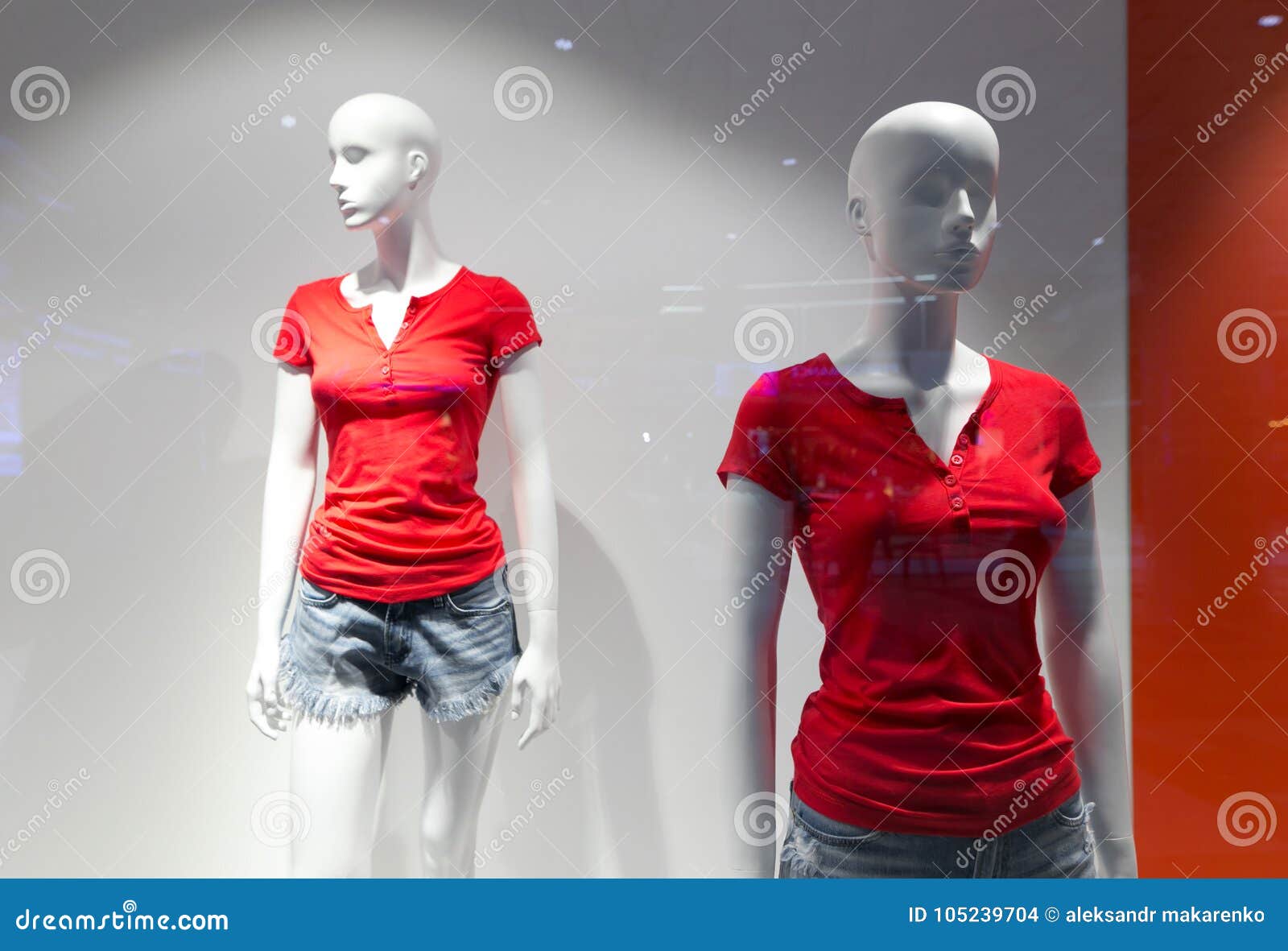 Discounts in the Storefront. Mannequins in Red. Stock Photo Image of