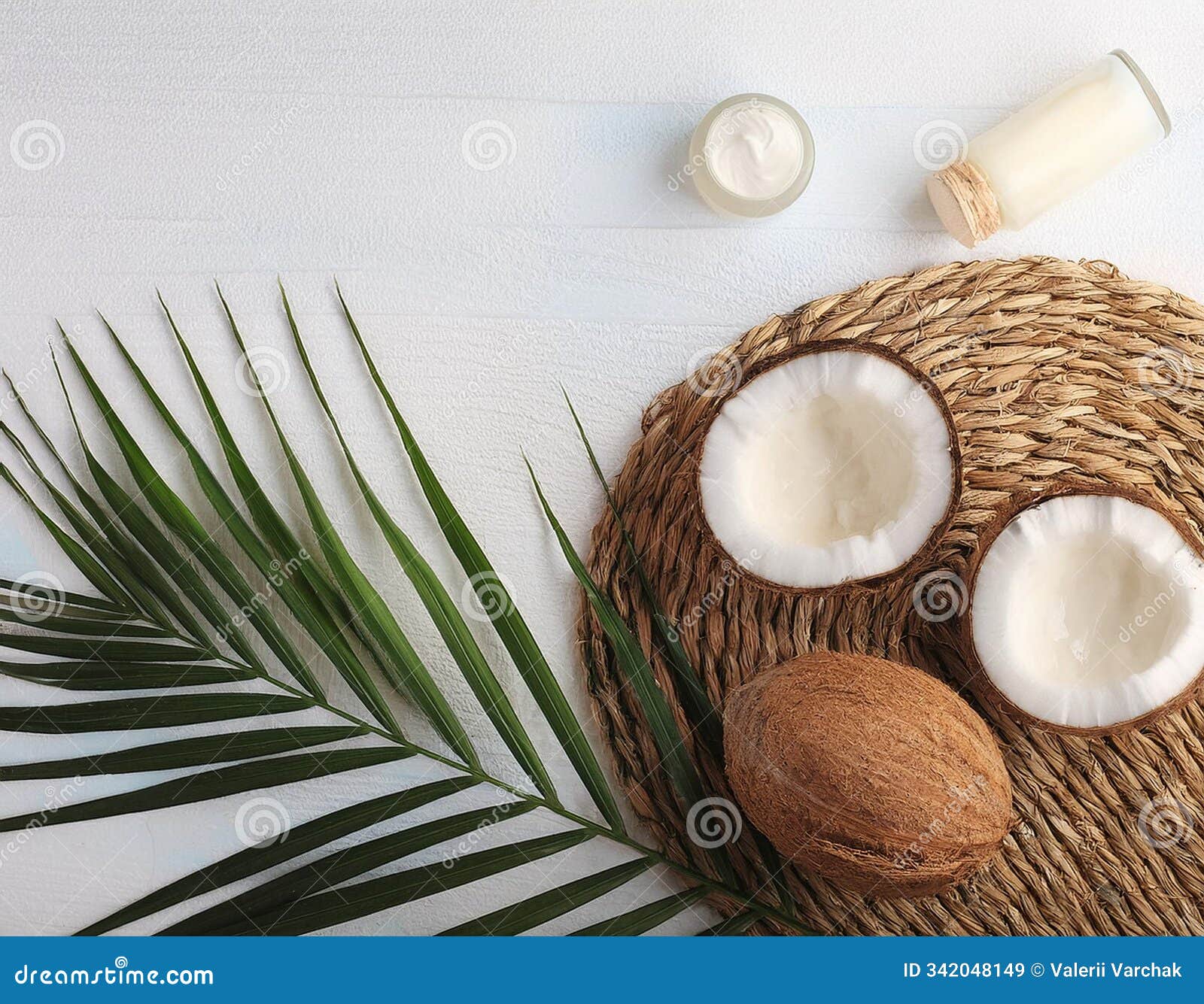 exotic coconut leaf and care products on colored background - top view cosmetics with coconut