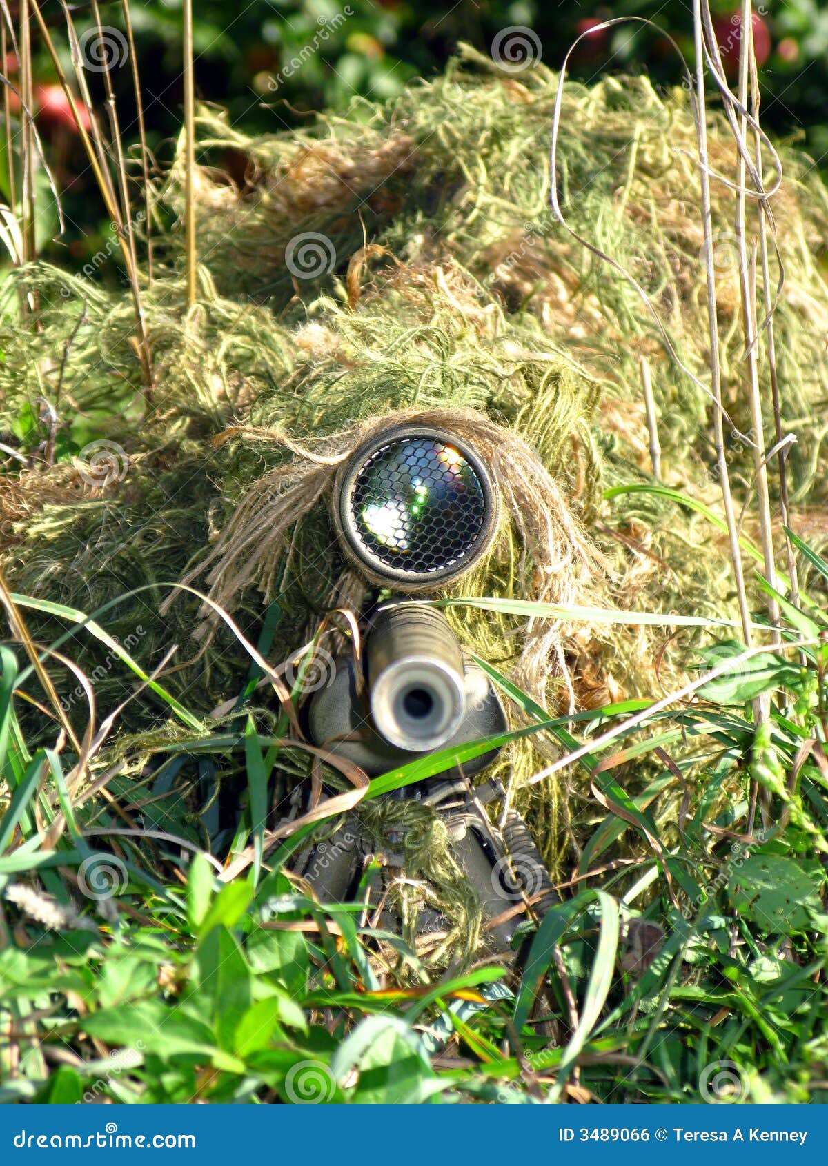 disguised sniper and his rifle