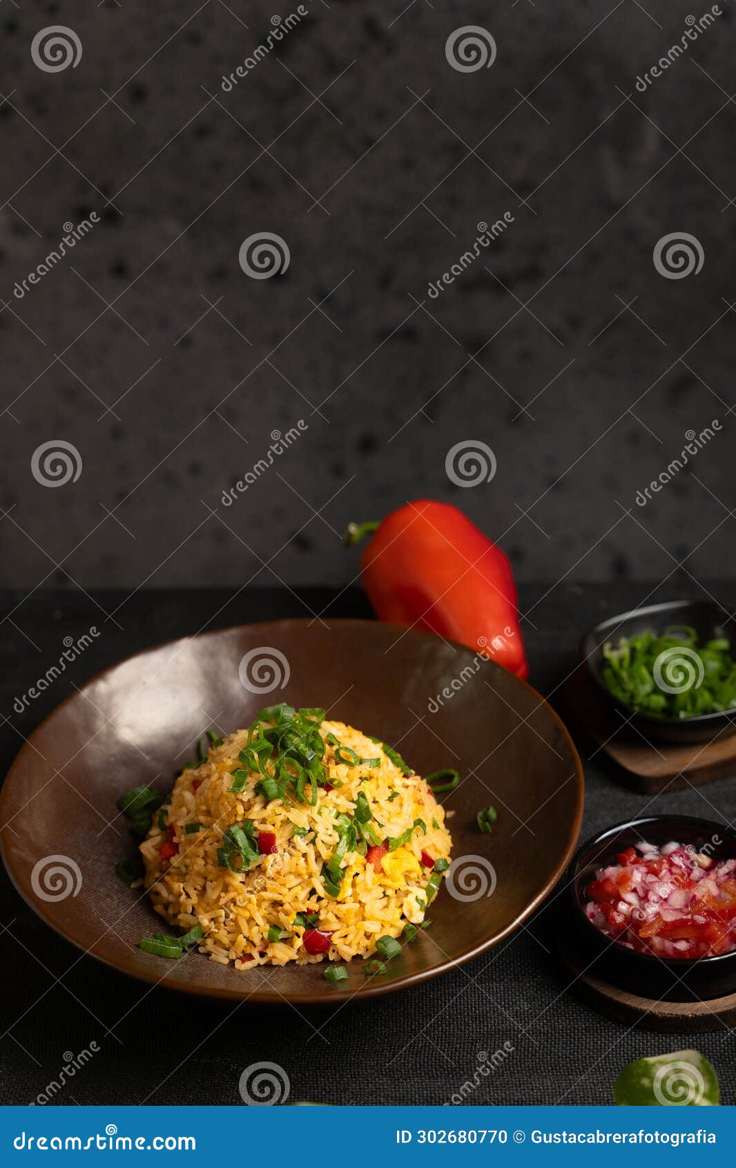 dish and colored ingredients on a dark background.