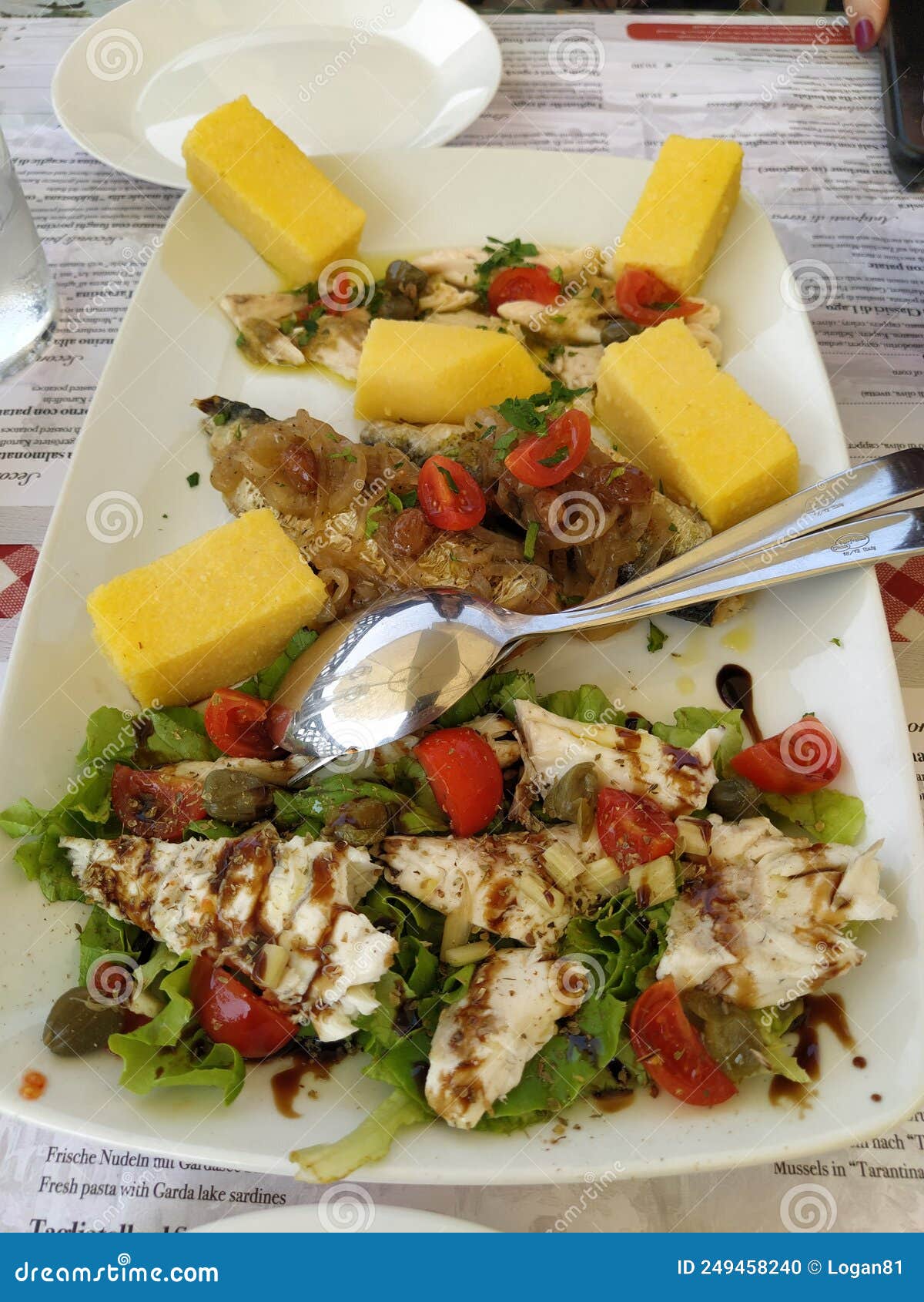 Dish of fish and polenta stock photo. Image of polenta 249458240