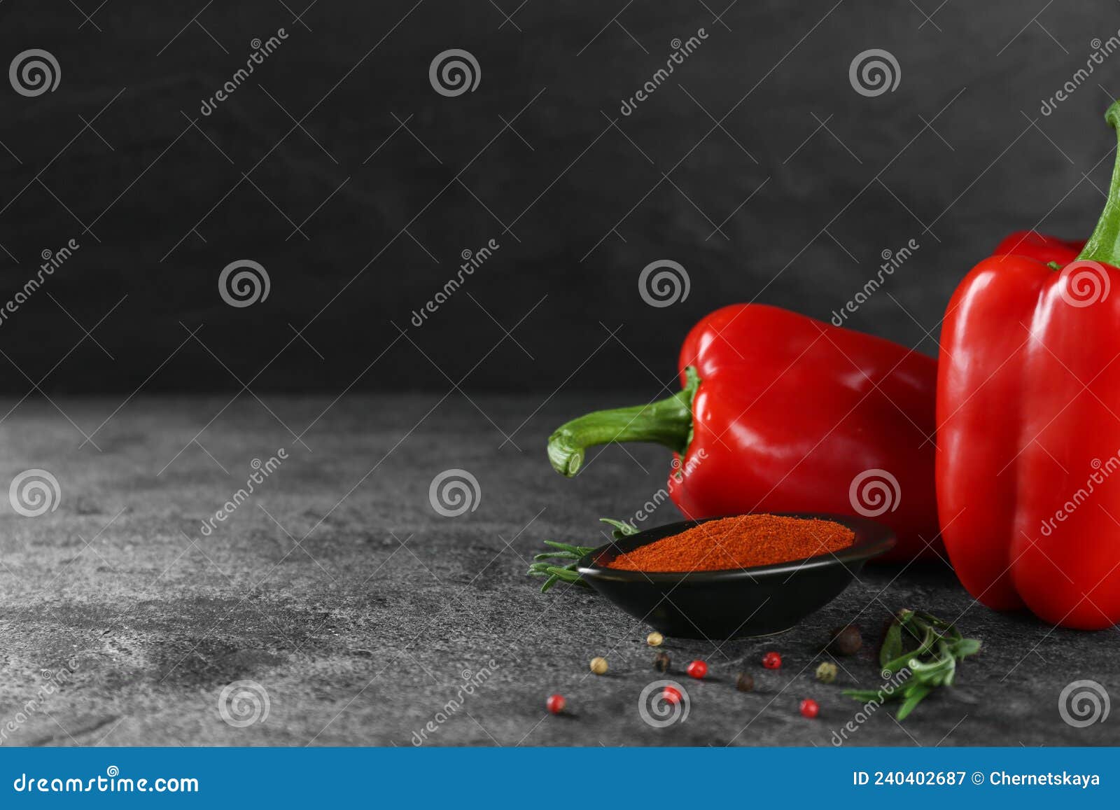 Dish of Paprika with Ingredients on Grey Table. Space for Text Stock