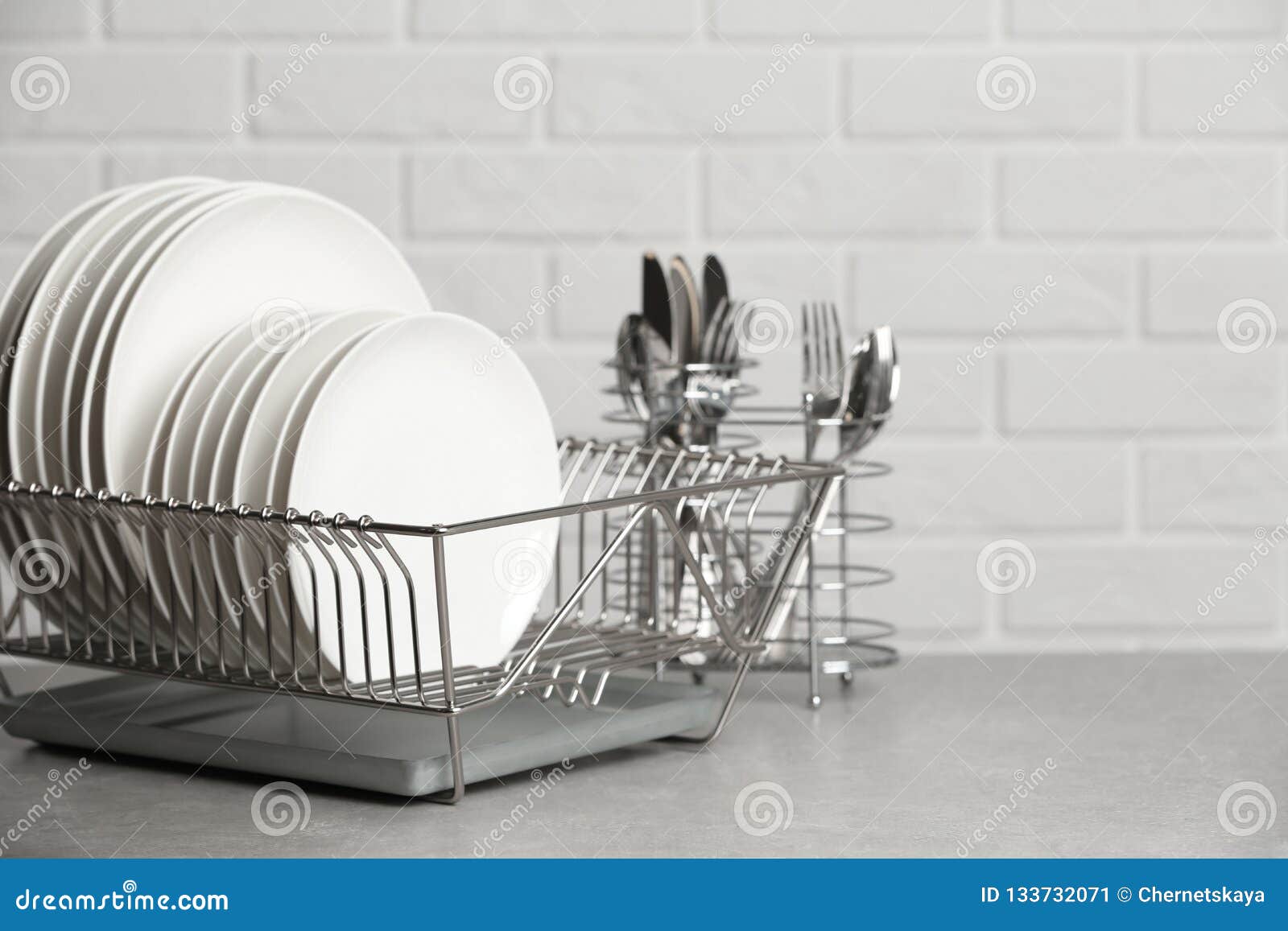 Dish Rack with Clean Plates on Table Near Brick Wall Stock Image Image of china, dinner 133732071