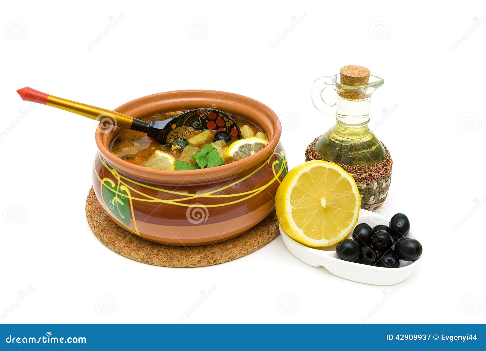 dish of russian hodgepodge soup in ceramic pot on white background