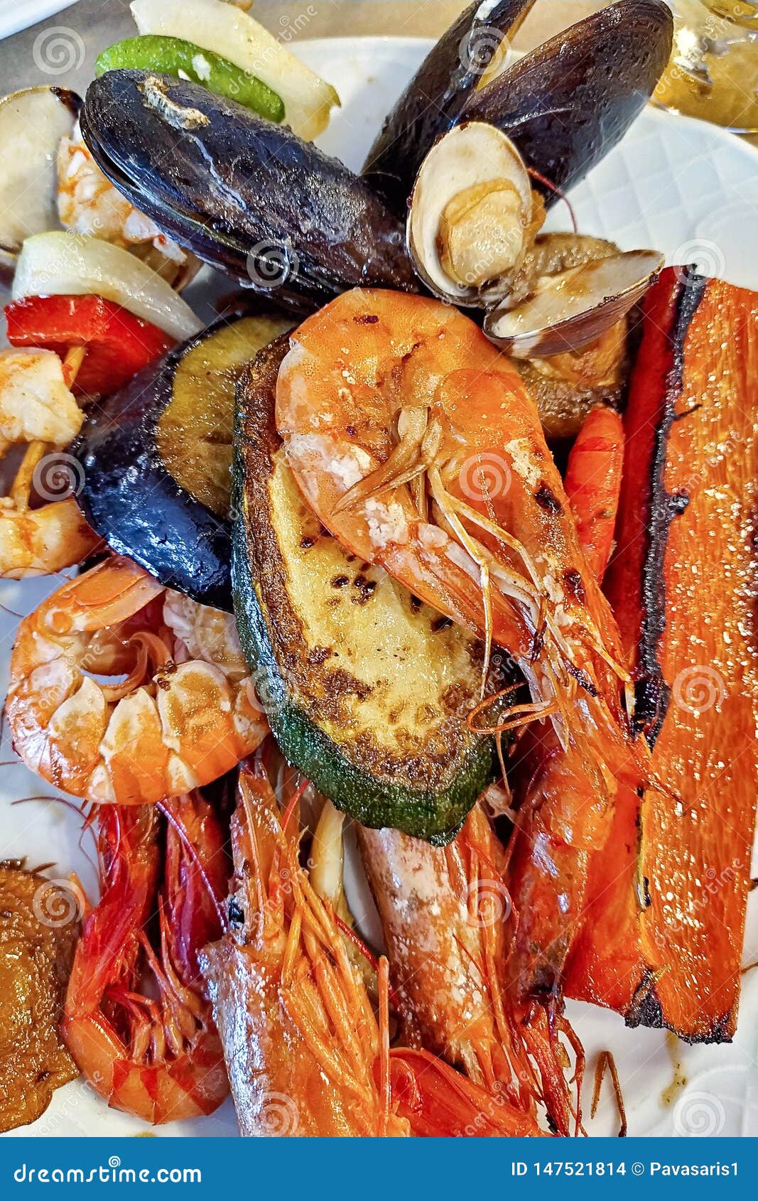 A Dish with Seafood and Grilled Vegetables in Closeup. Mixed Seafood