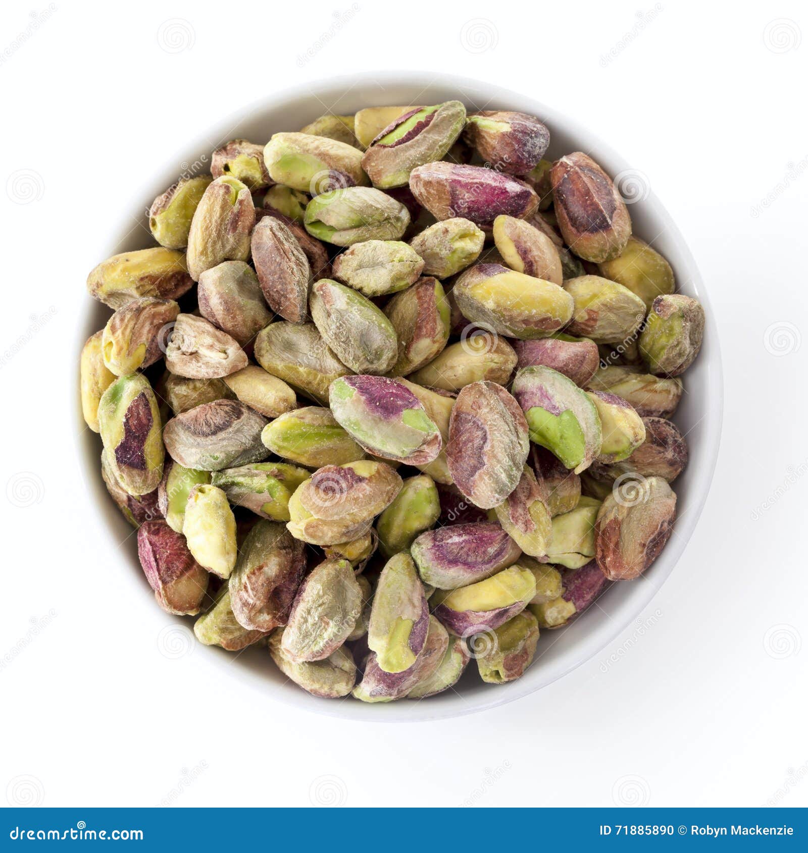 Dish of Shelled Pistachio Kernels Isolated on White Overhead View Stock