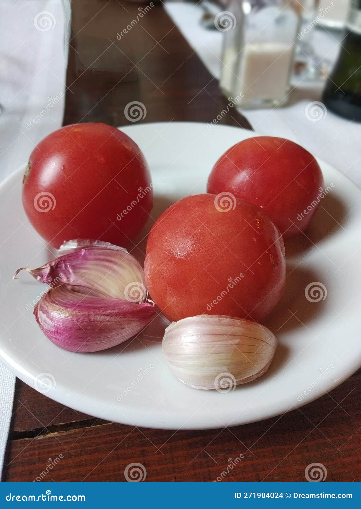Dish with Tomatoes and Garlics on the Table Stock Photo Image of dish