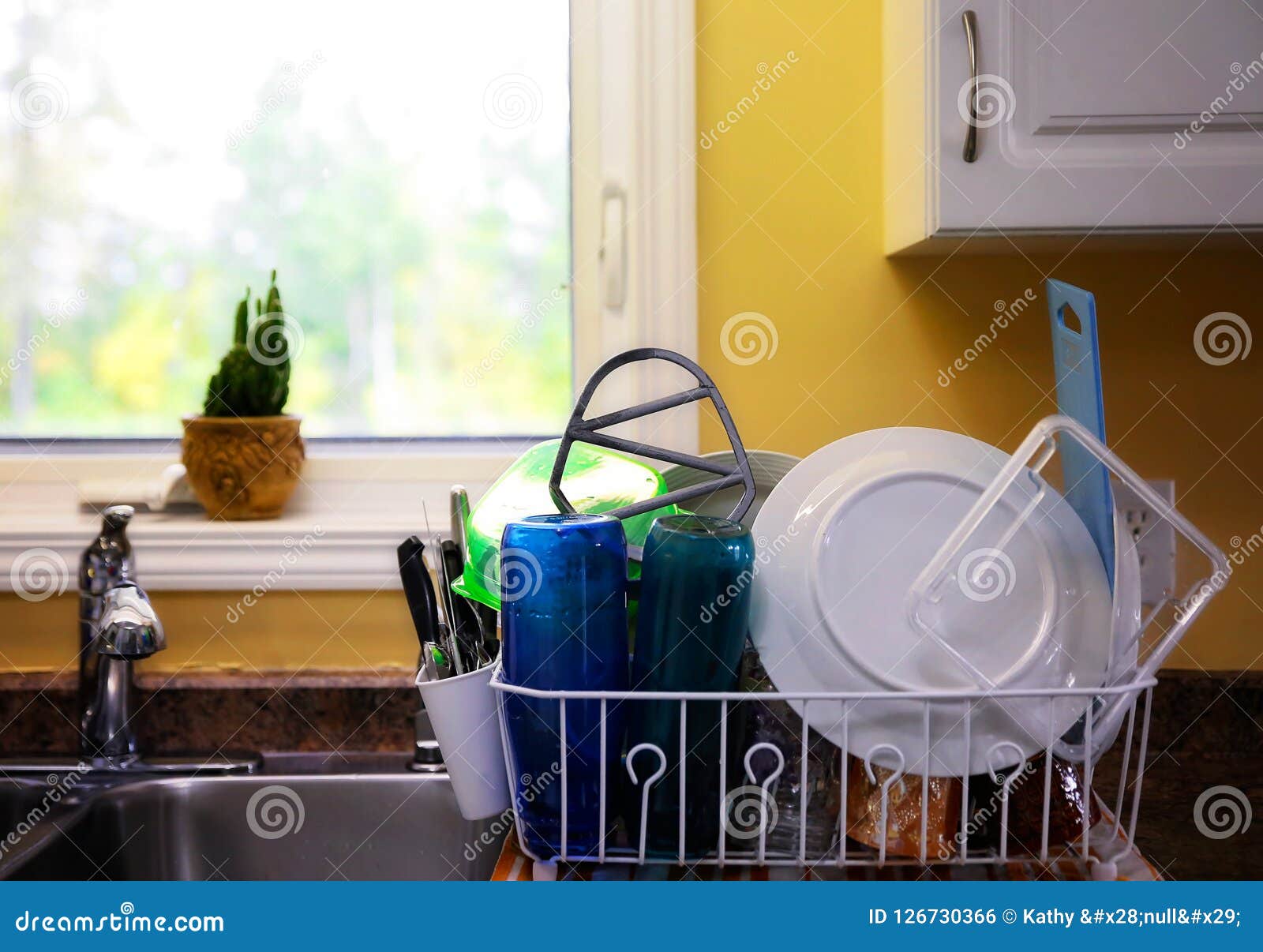 Dishes Drying on a Kitchen Counter Stock Photo Image of group