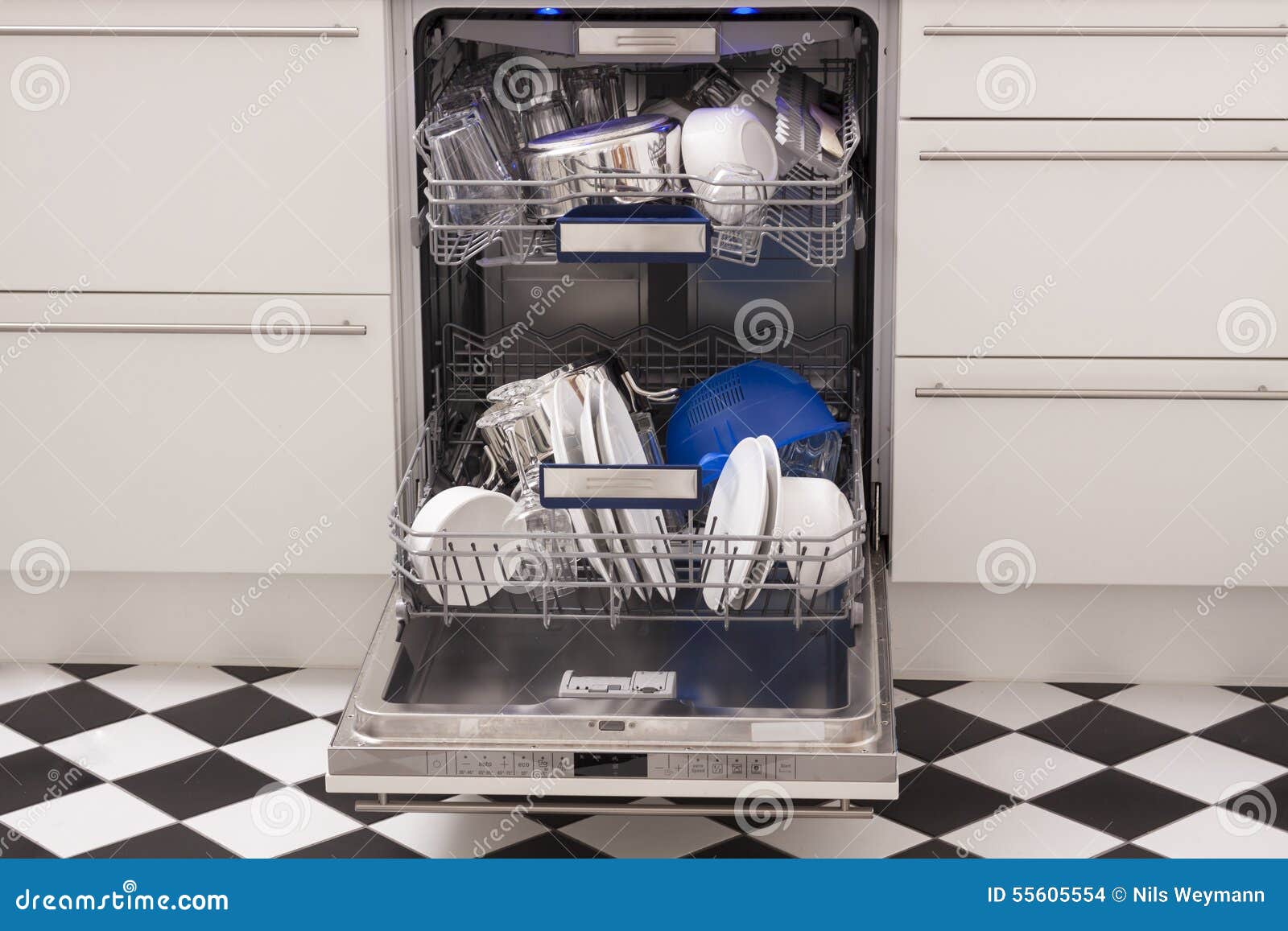 dishwasher loads in a kitchen with clean dishes