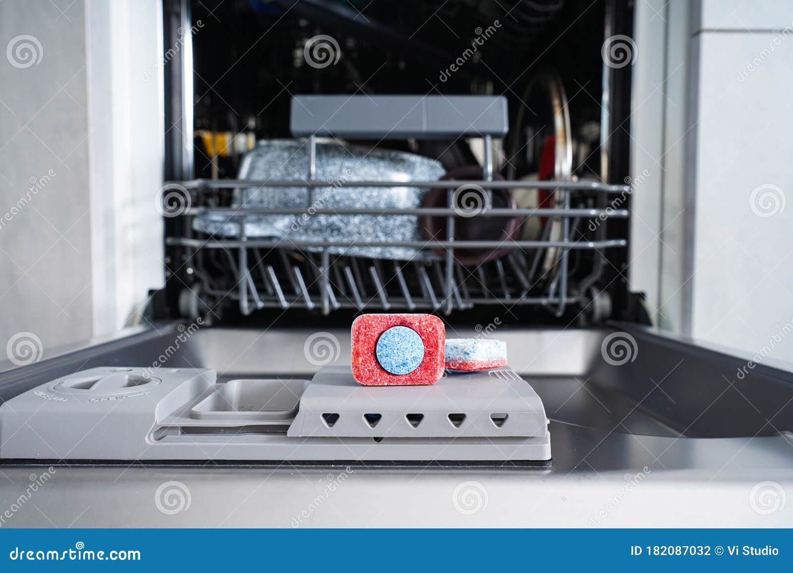 Dishwasher Tablet in a Plastic Dishwashing Container, Closeup Stock