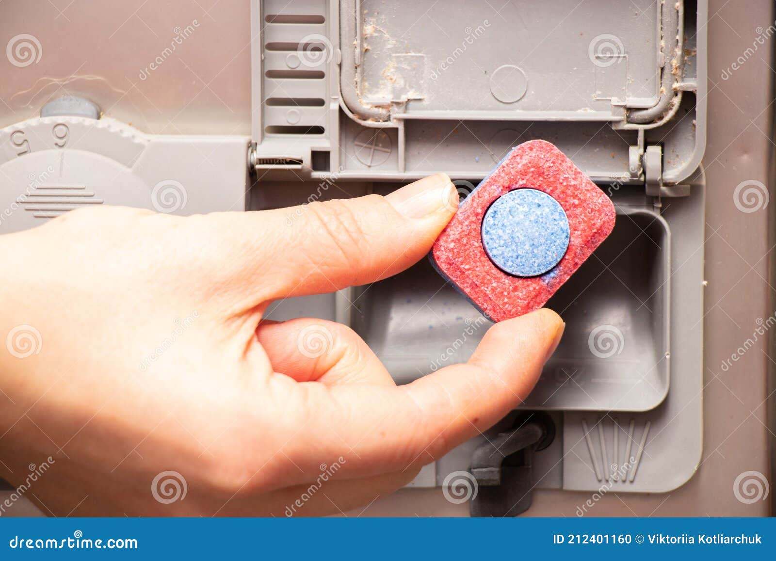 The Dishwashing Tablet is in the Dishwasher Container Stock Photo