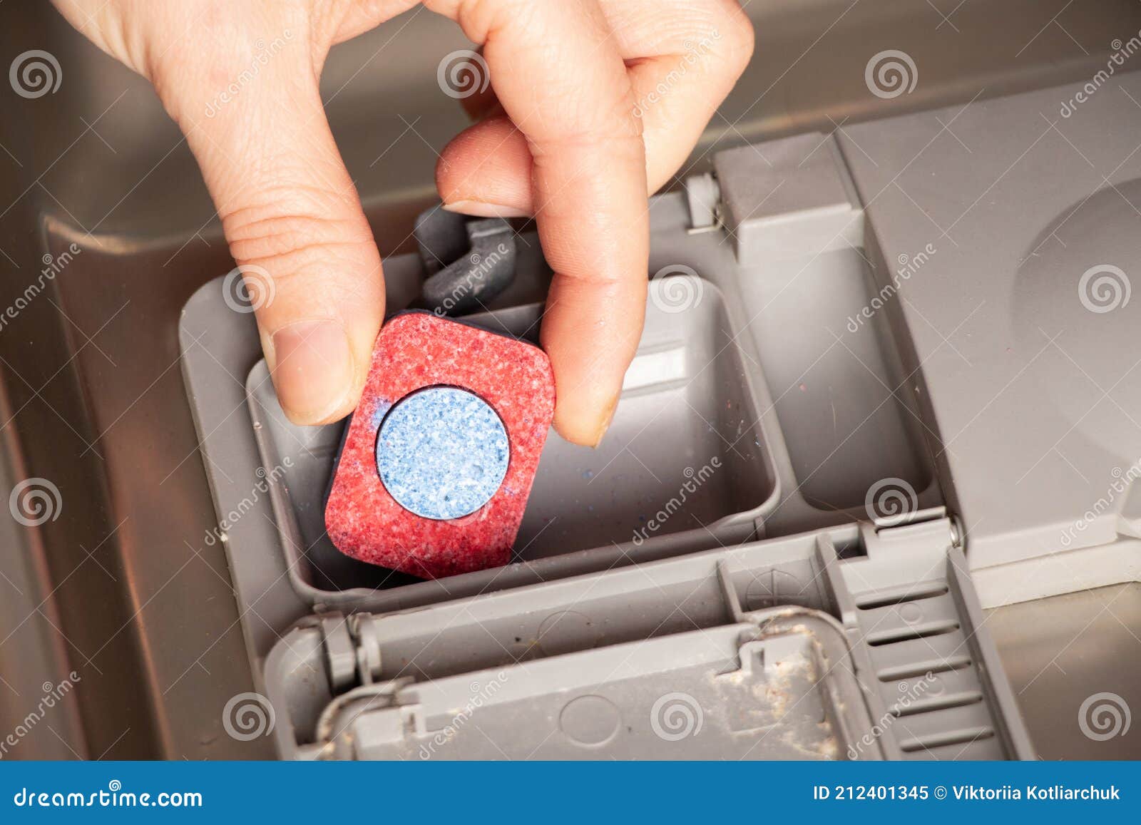 The Dishwashing Tablet is in the Dishwasher Container Stock Image
