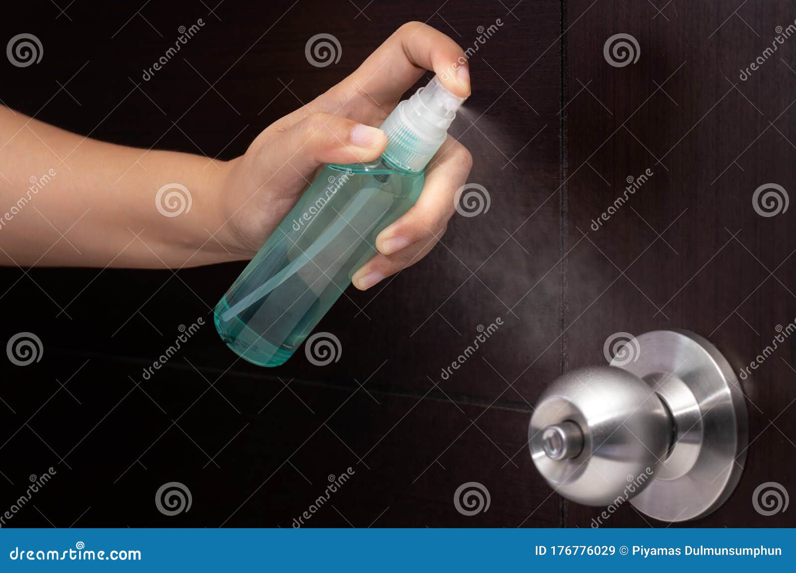 disinfect, sanitize, hygiene care. inject alcohol spray on door knob and frequently touched area for cleaning and disinfection