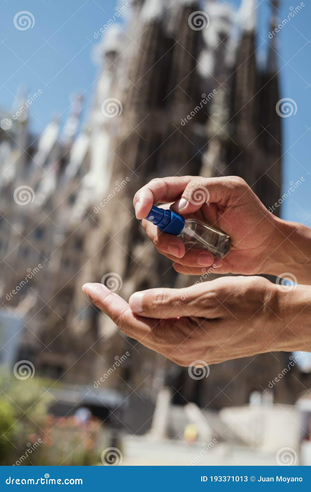 disinfecting hands in sagrada familia, barcelona