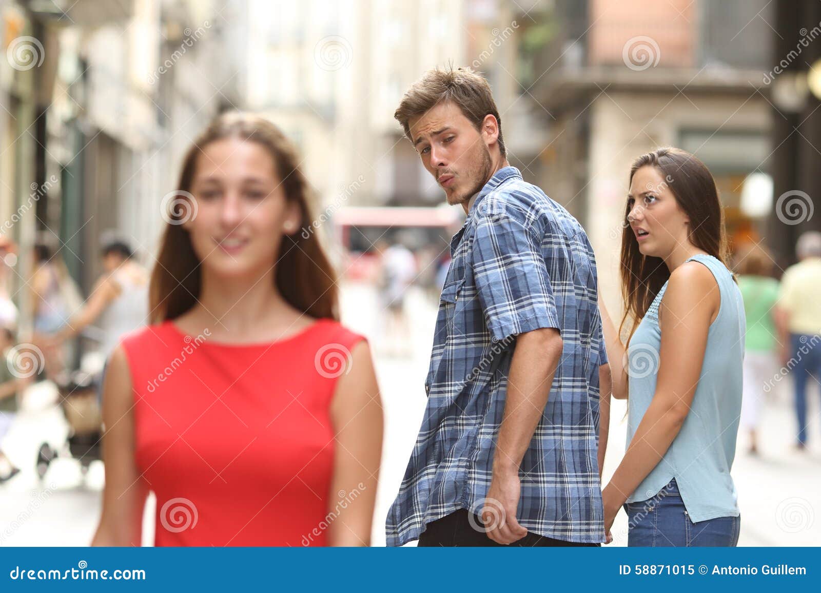 disloyal man with his girlfriend looking at another girl