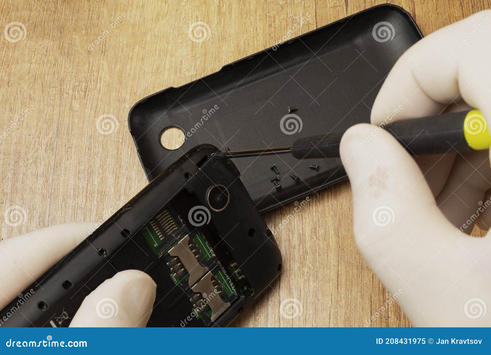 Dismantling an Old Phone for Repair on a Table Stock Image Image of