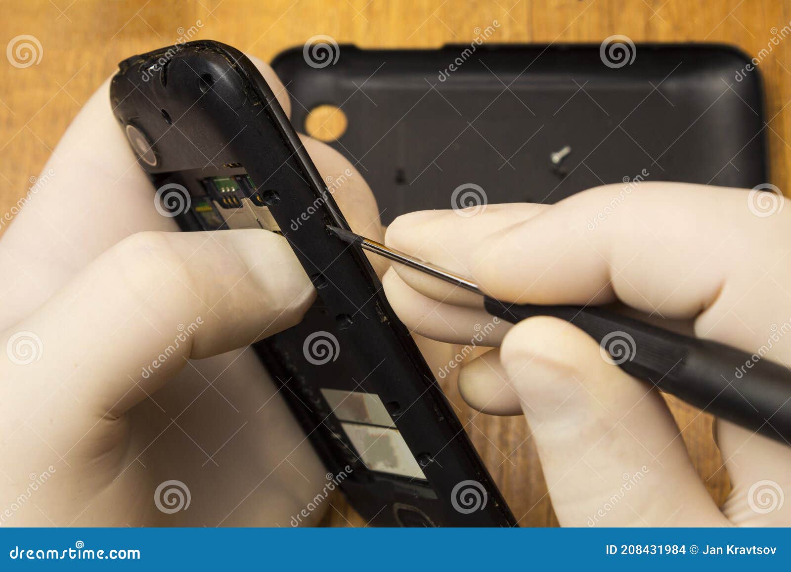 Dismantling an Old Phone for Repair on a Table Stock Photo Image of