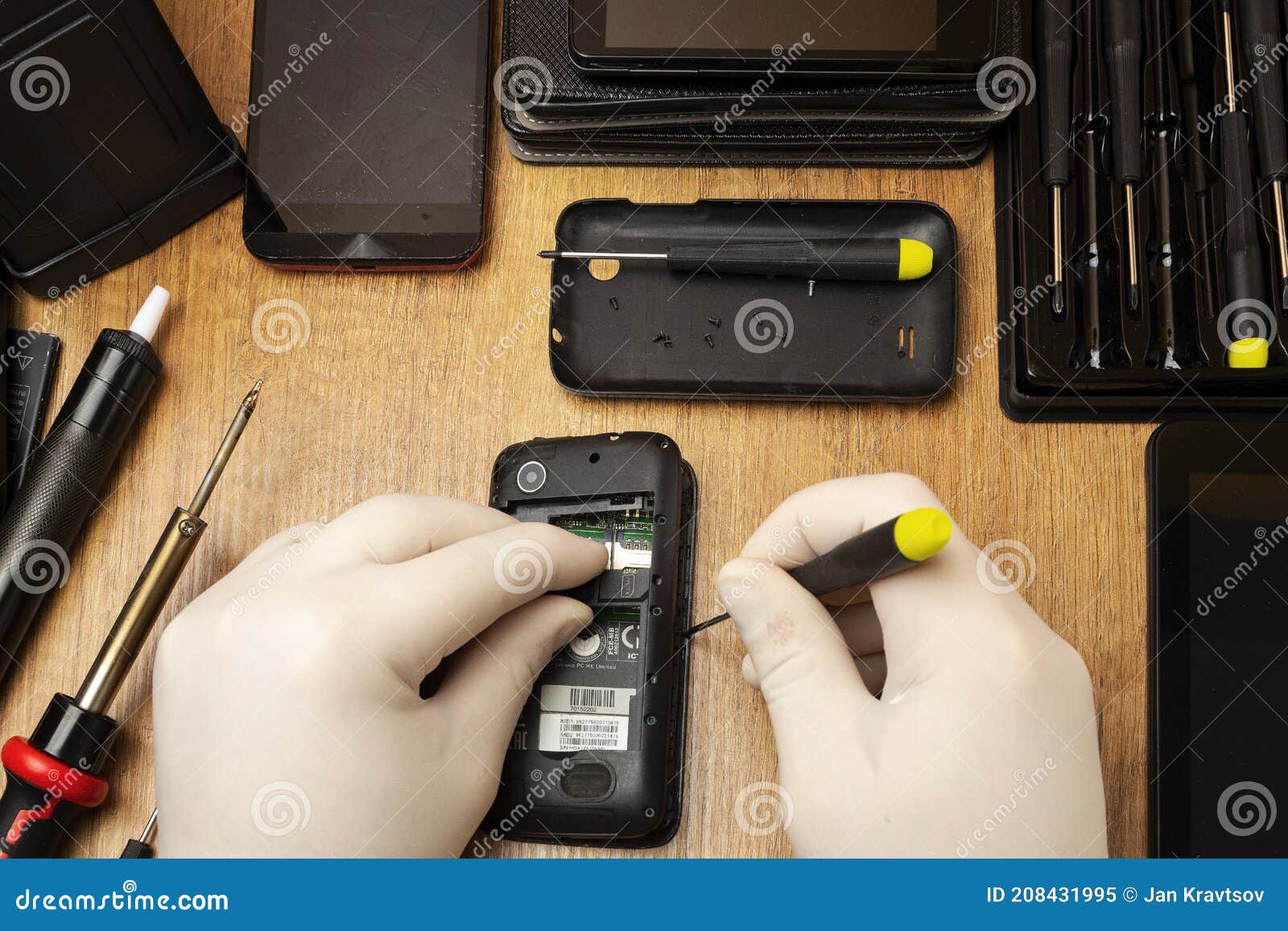 Dismantling an Old Phone for Repair on a Table Stock Image Image of