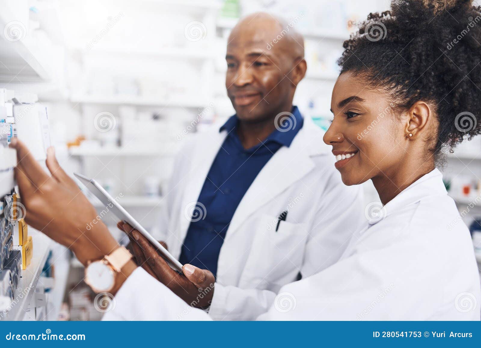 Dispensing with Teamwork. Two Pharmacists Doing Inventory in a Pharmacy