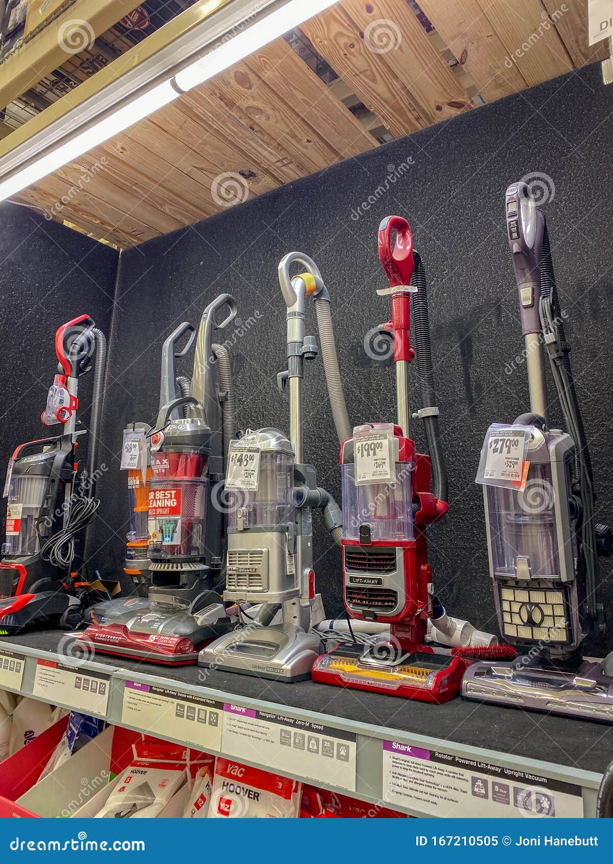 A Display Shelf Of Vacuums For Sale At A Home Depot Store