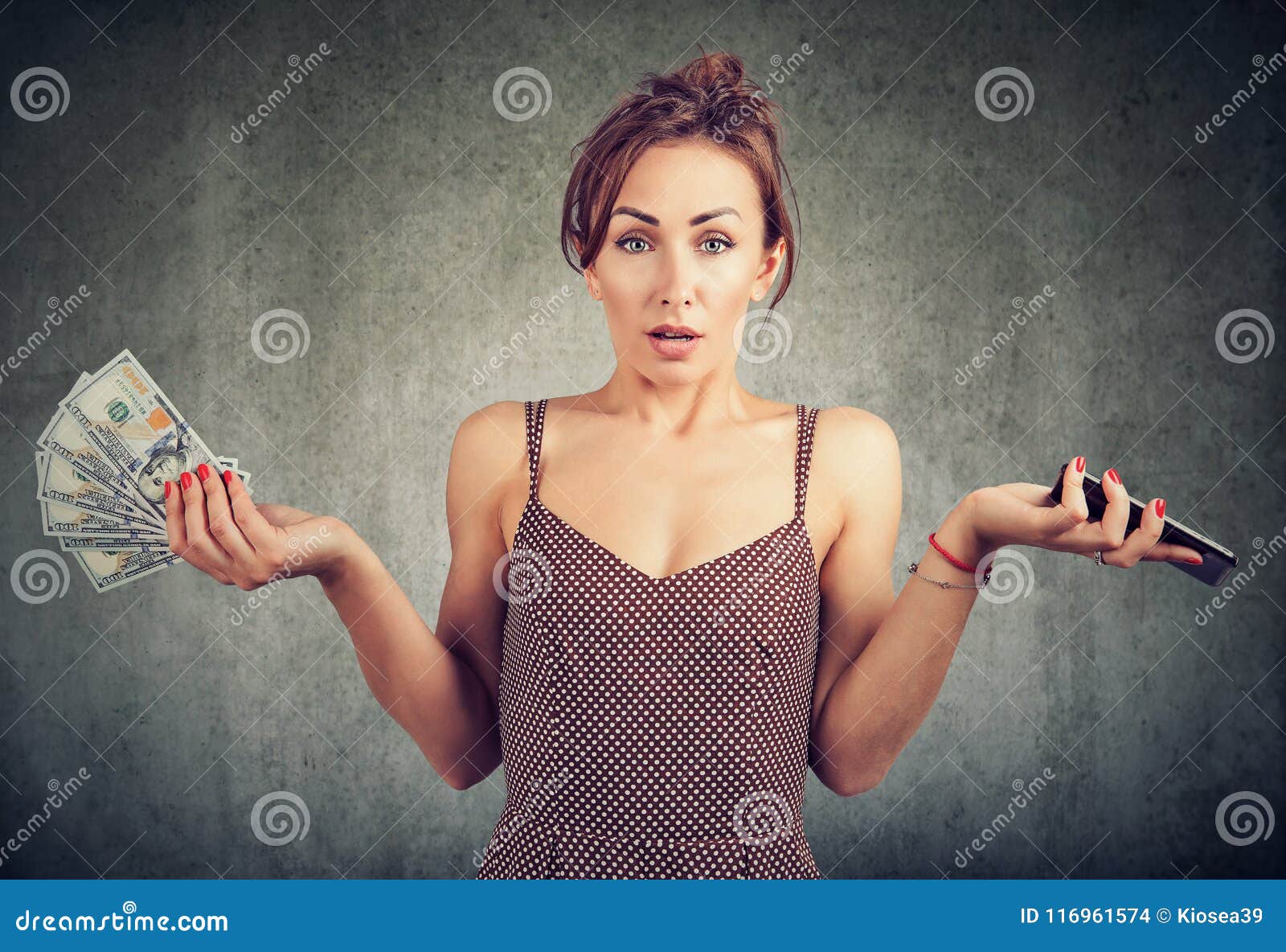 displeased woman holding smart phone and money dollar cash, unhappy with cellular service charges