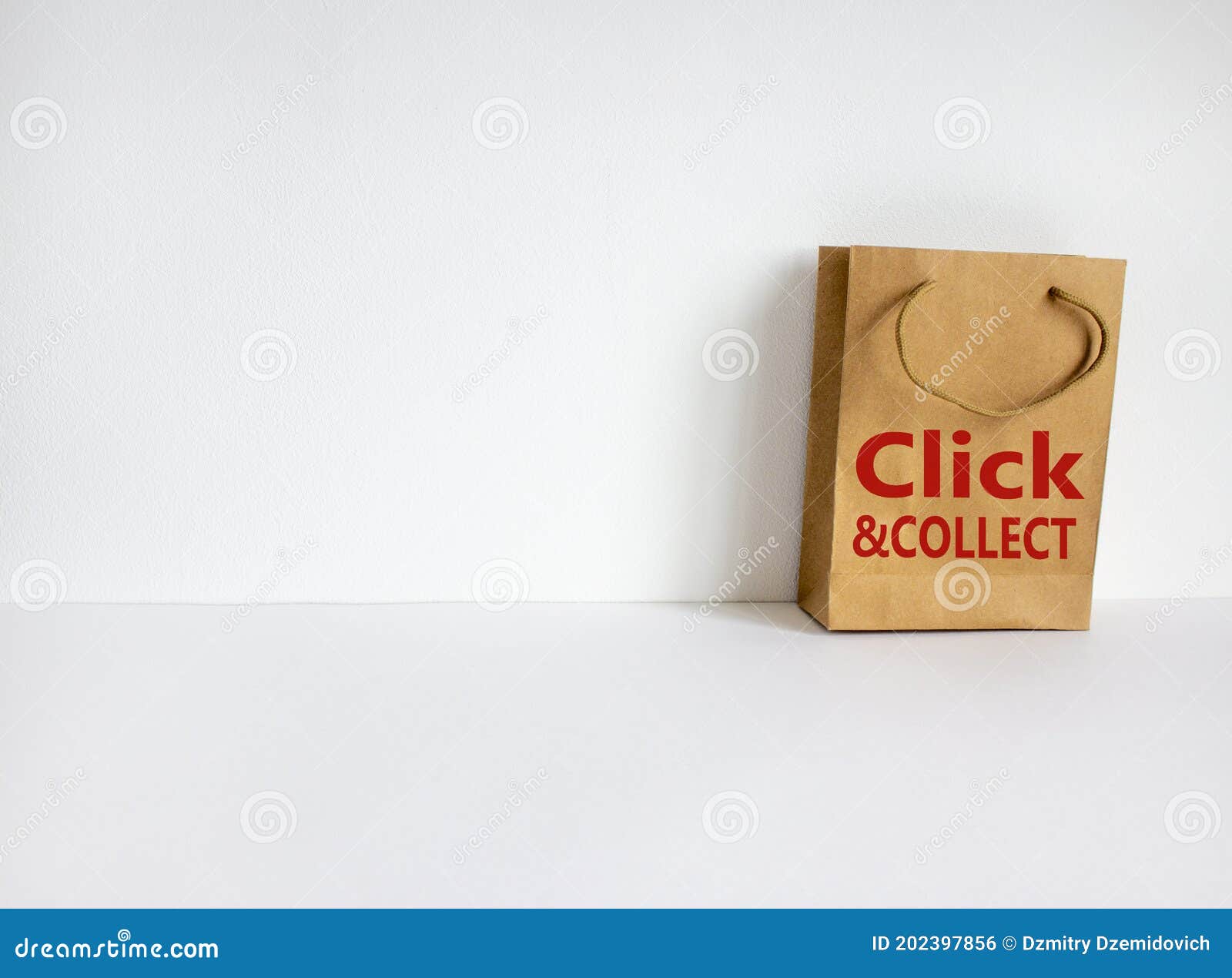 disposable bag of kraft paper on a beautiful white background with expression `click and collect`. beautiful white background,