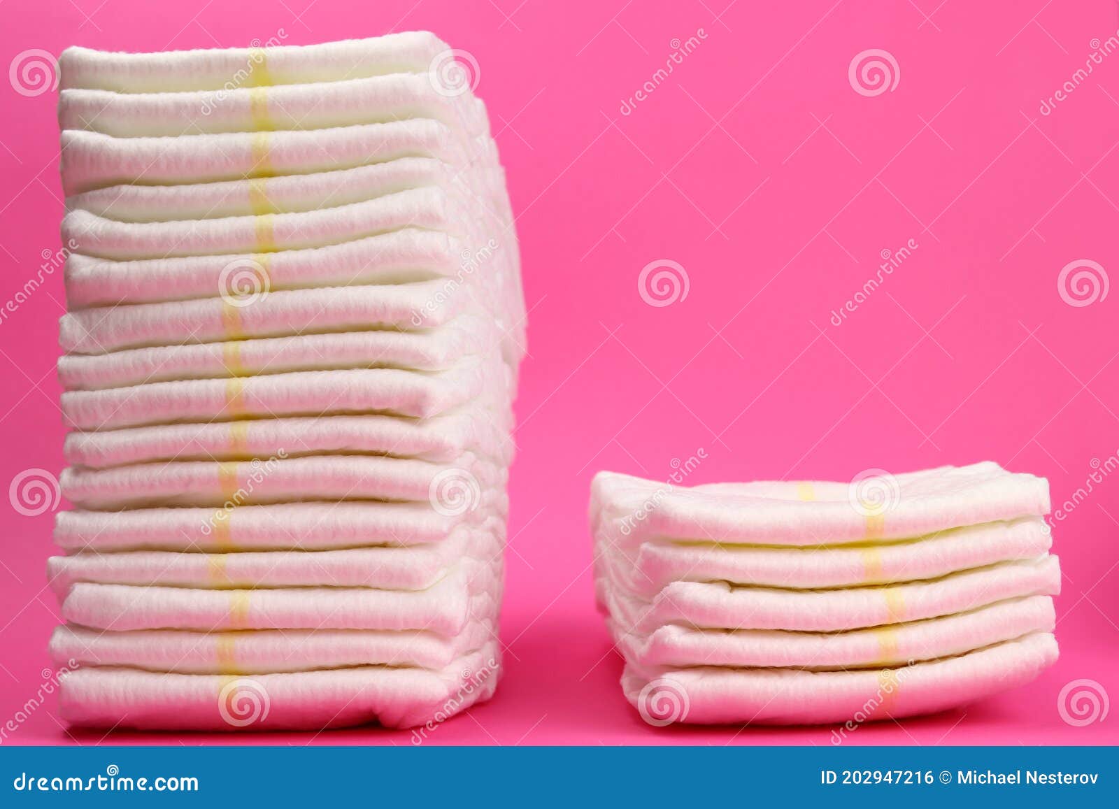 Disposable Diapers in a Stack on a Pink Background Stock Photo - Image ...