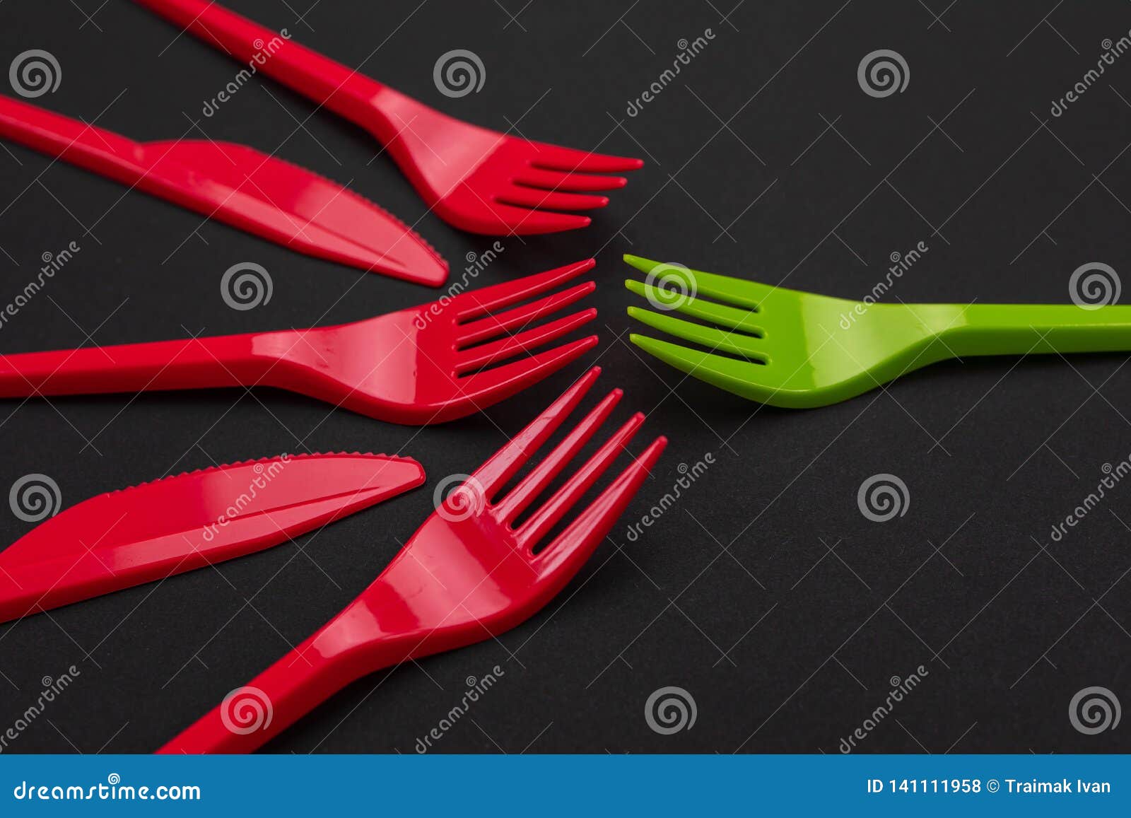 Disposable Red and Green Plastic Forks on Background Stock Photo
