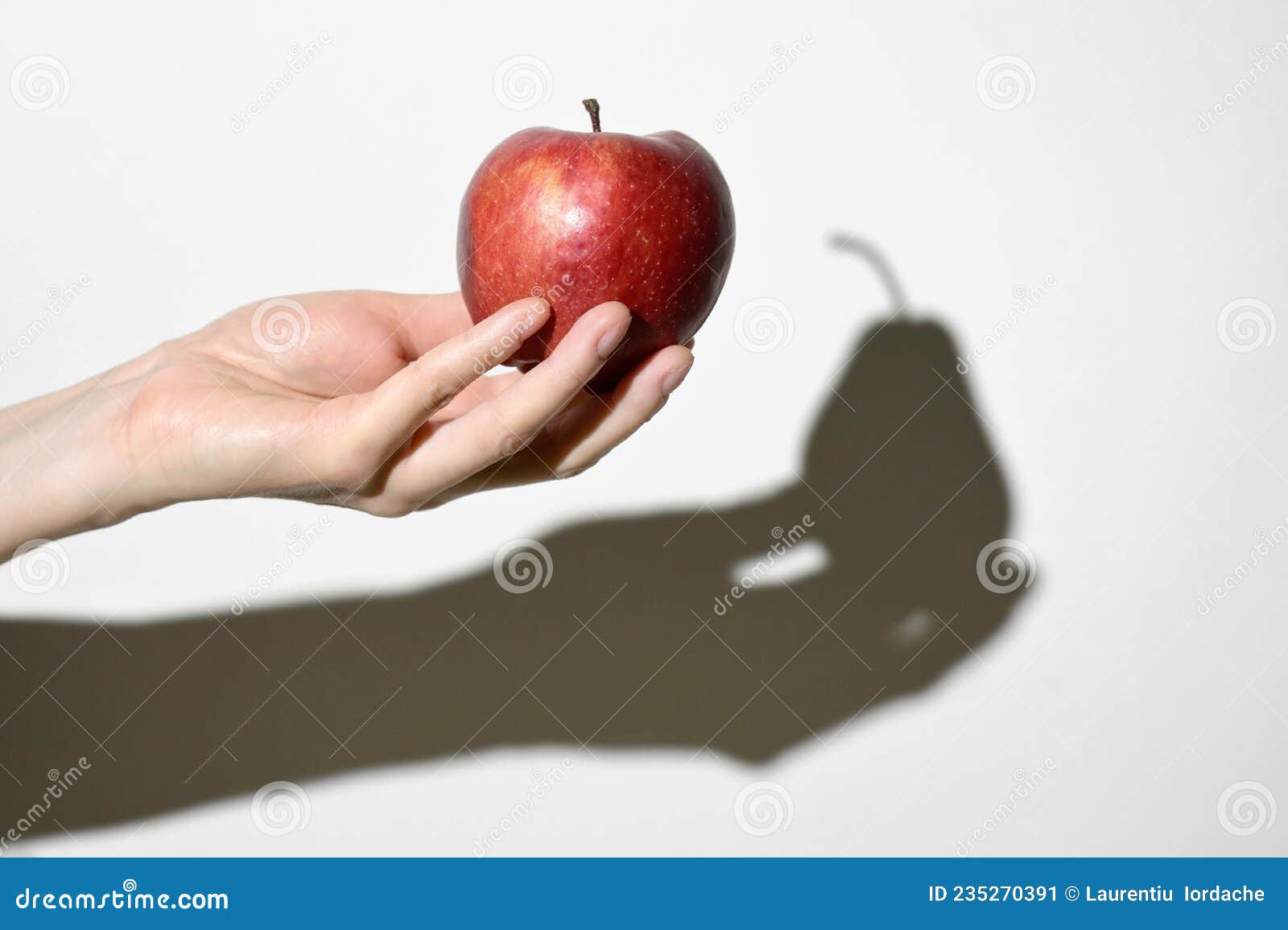 dissonance concept. apple fruit and pear fruit shadow