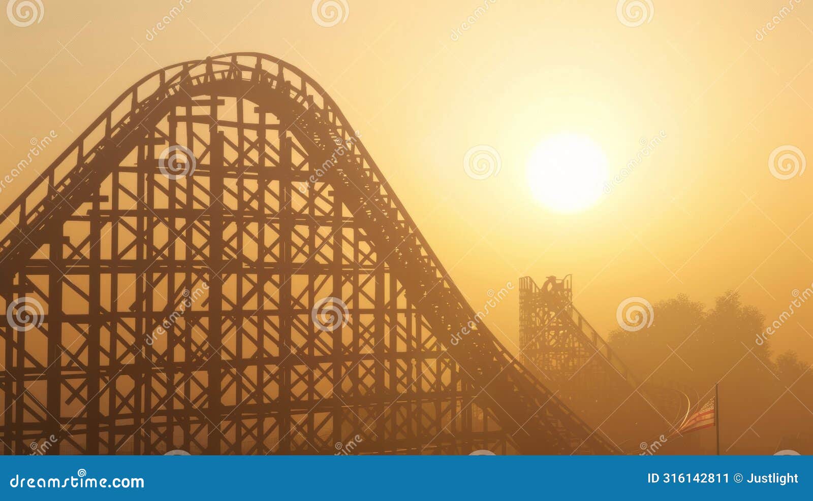 the distant silhouette of a towering roller coaster against a hazy sunlit sky hinting at the thrill of plunging speeds