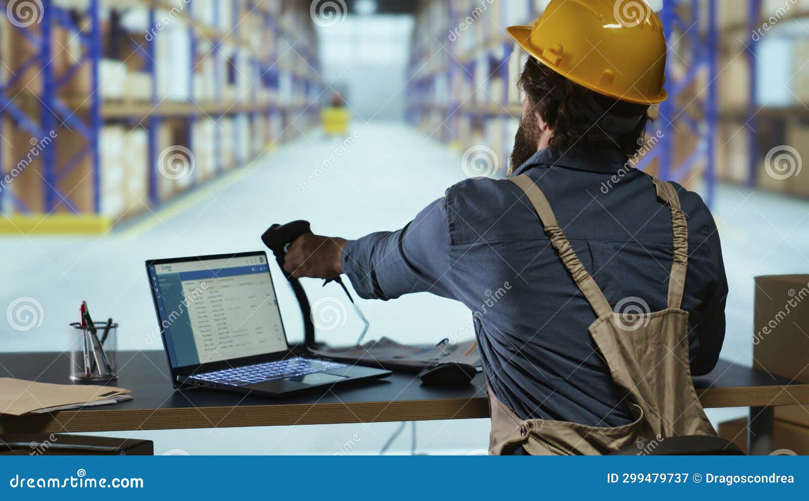 Distribution Operations Manager Works with Barcode Reader Stock Image