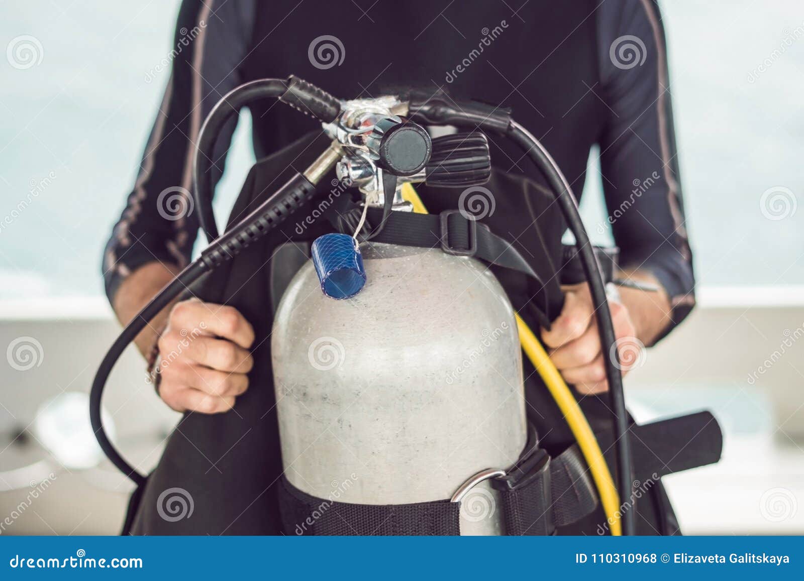 Diver Prepares His Equipment for Diving in the Sea Stock Photo Image