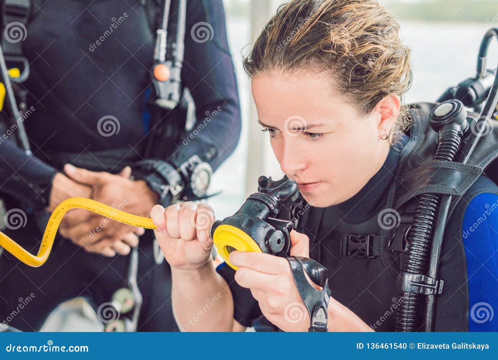 Diver Prepares His Equipment for Diving in the Sea Stock Photo Image