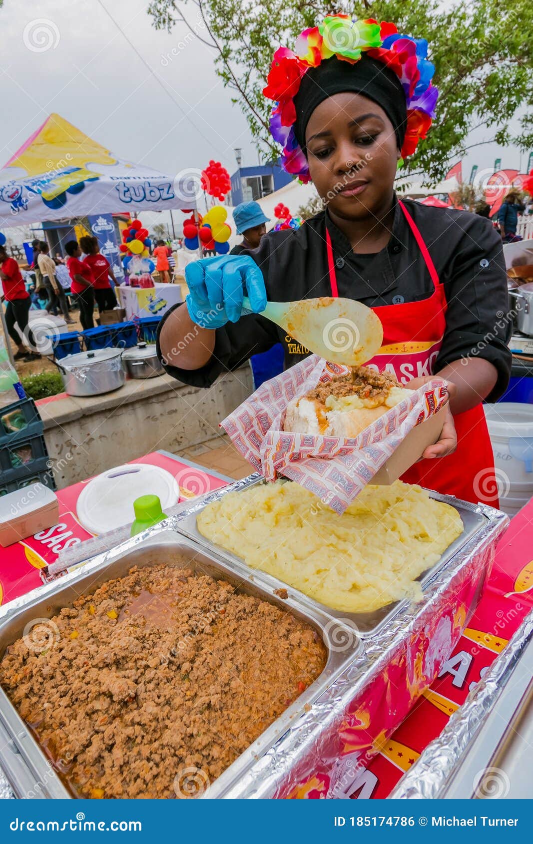 Diverse African Vendors Cooking and Serving Various Bread Based Street