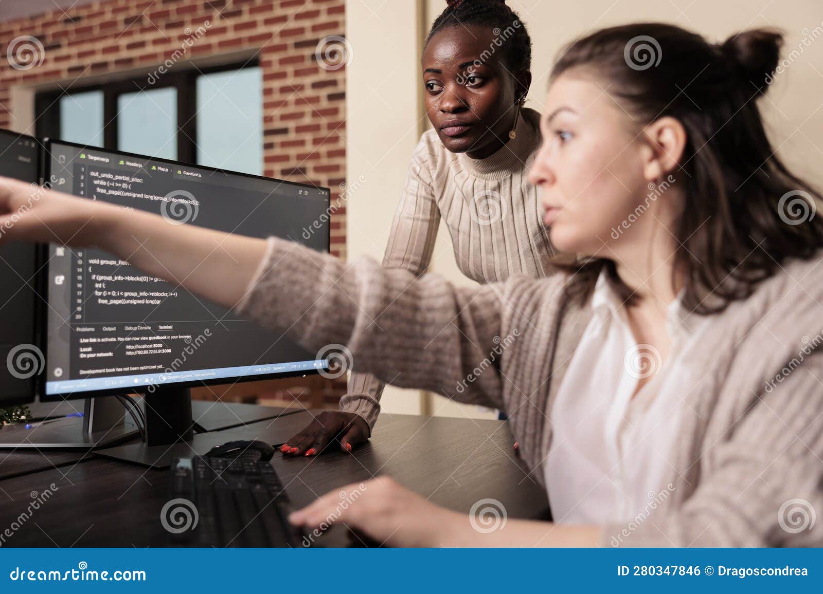 diverse coders working on terminal window with html script