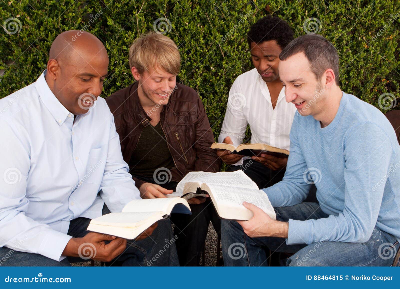 diverse group of men studying together.