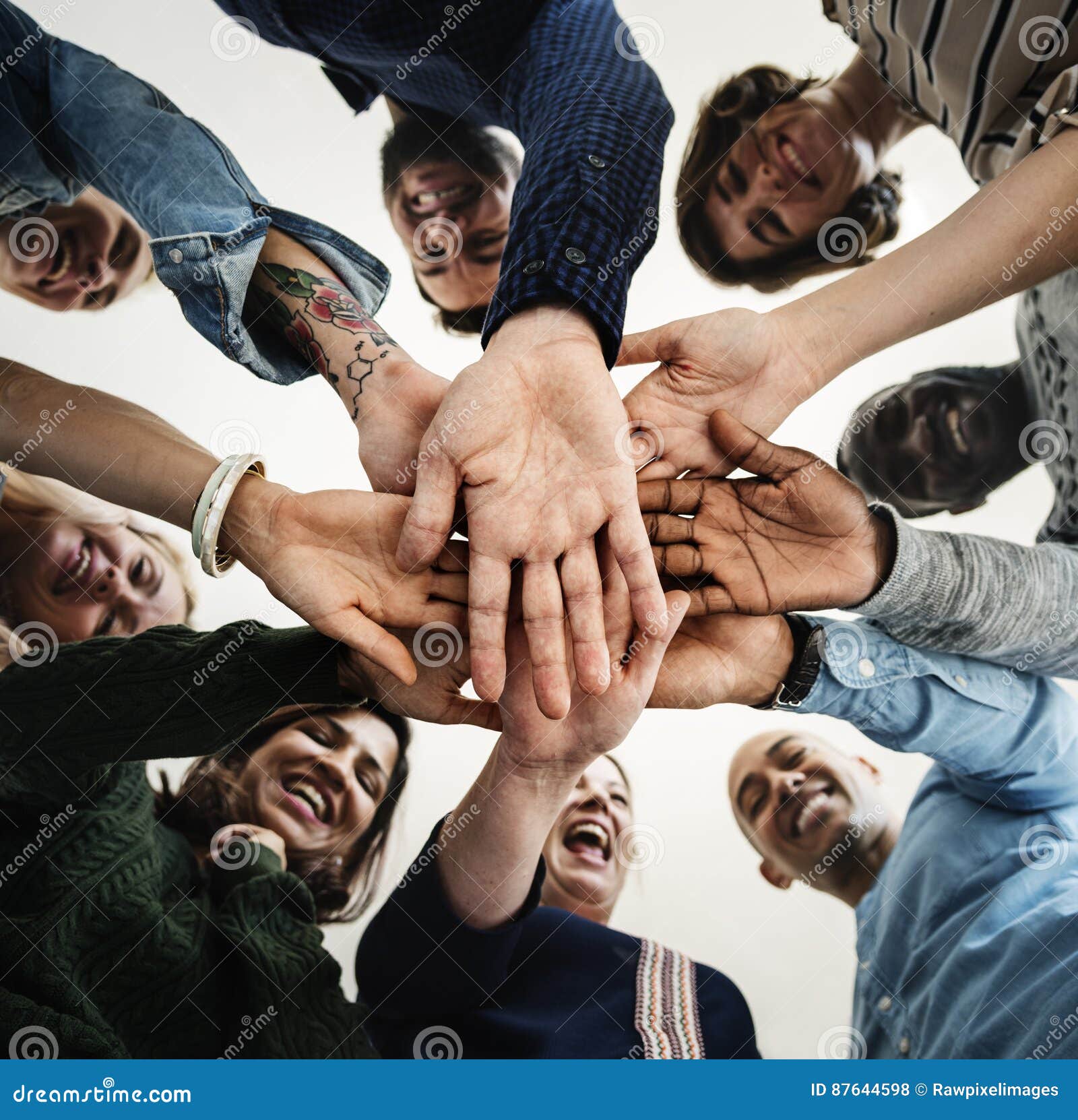 diverse people hands together partnership