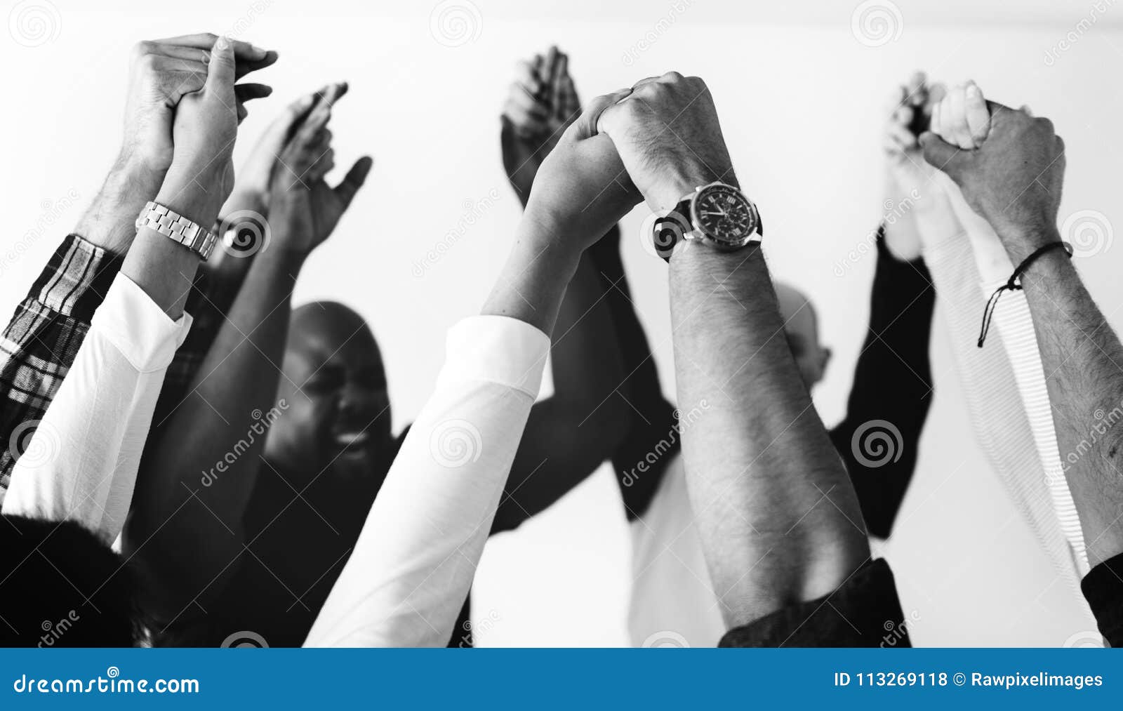 diverse people joining hands together teamwork and winning concept