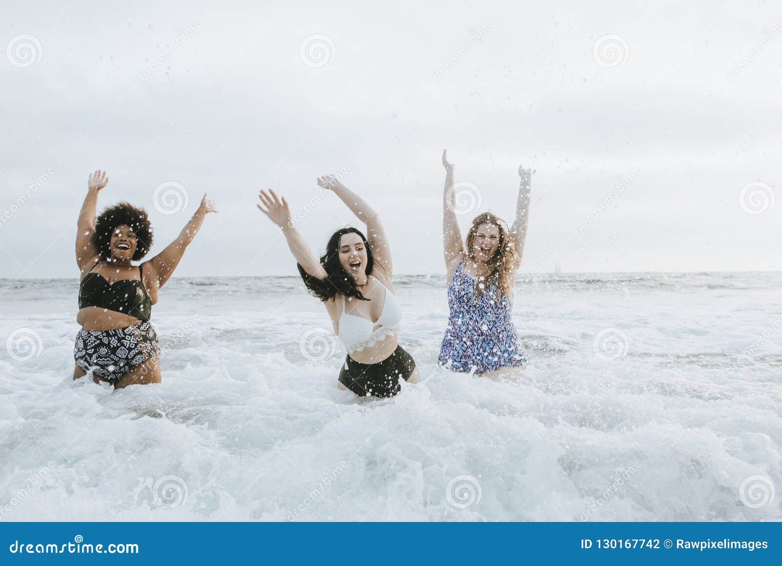 diverse plus size women having fun in the water