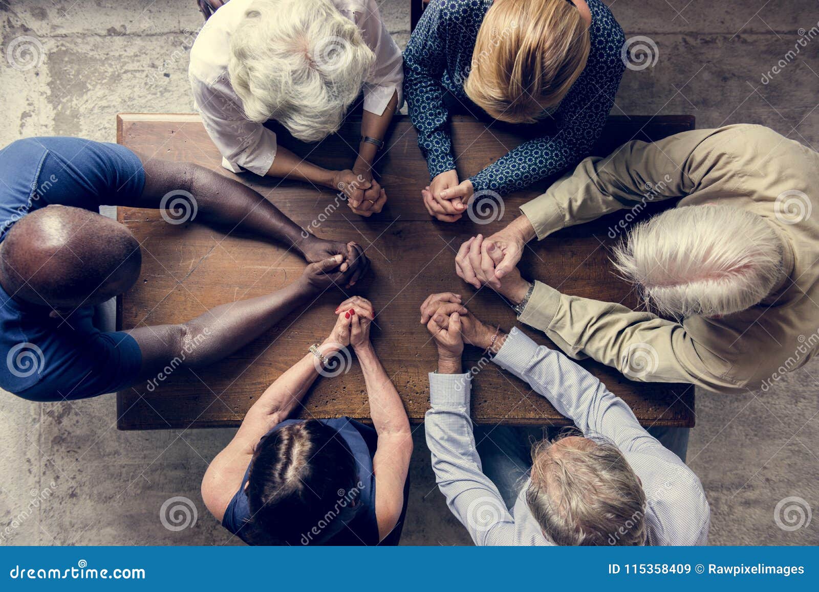 diverse religious people praying together