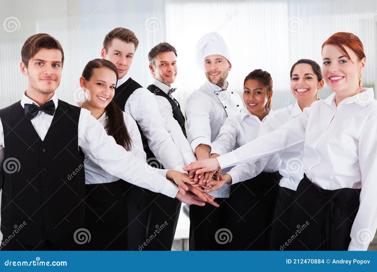 diverse team of waiters and hospitality staff people