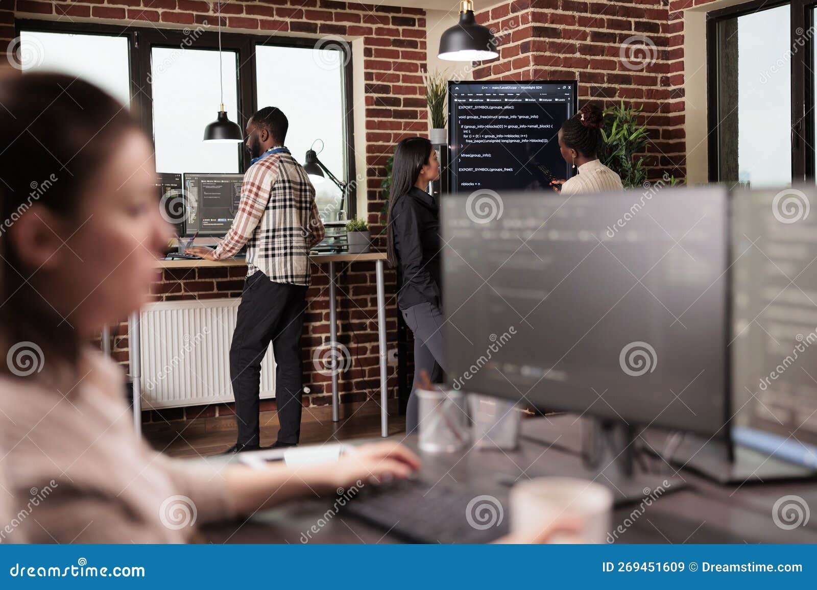 diverse tech enginners analyzing machine learning app code